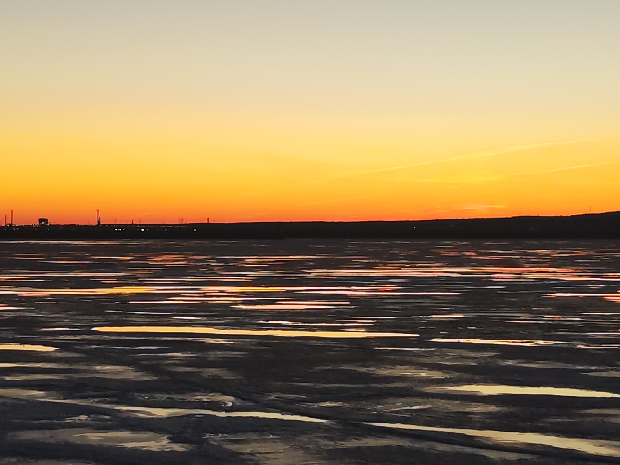Sunset observed over water in Chaikovsky, Russia