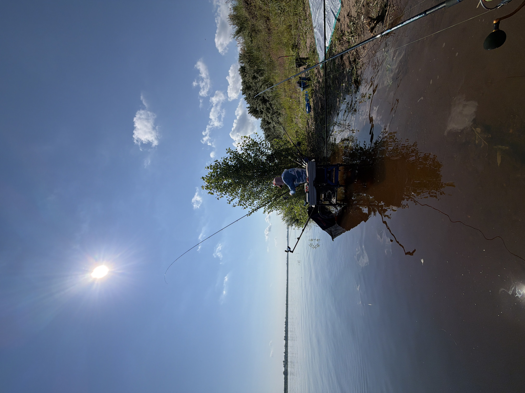Riverside fishing session near Tarasovo on a calm summer morning