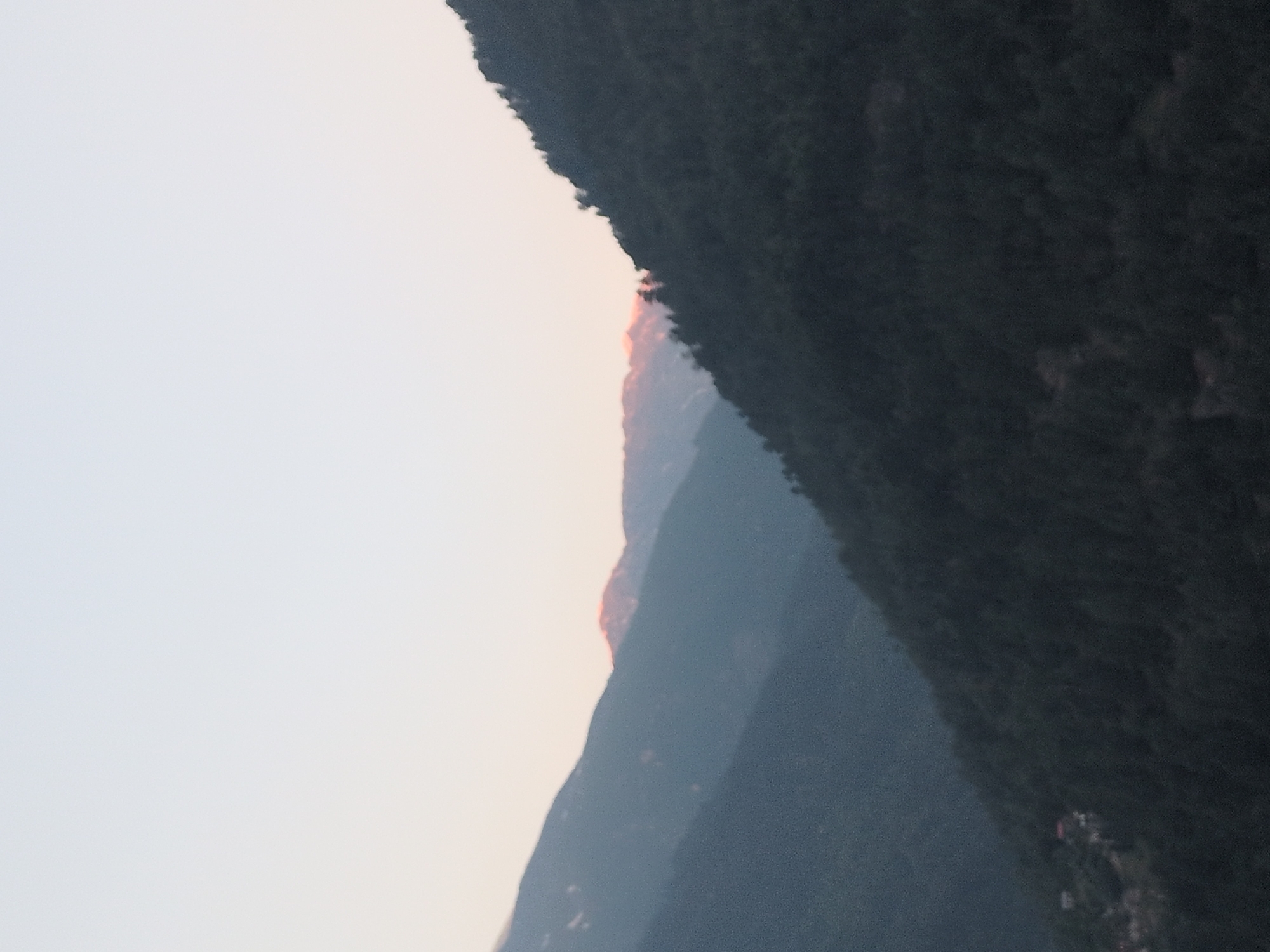 Dawn breaks over Himalayan peaks in Vashisht, India