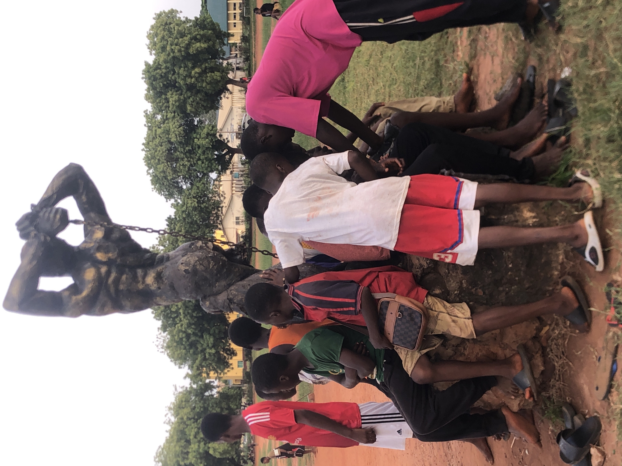 Young men play informal soccer in Nsugbe, Nigeria