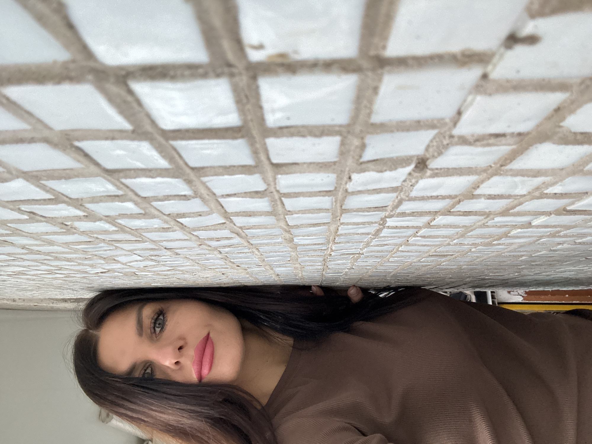 Woman photographed in multiple indoor settings in Chaikovsky
