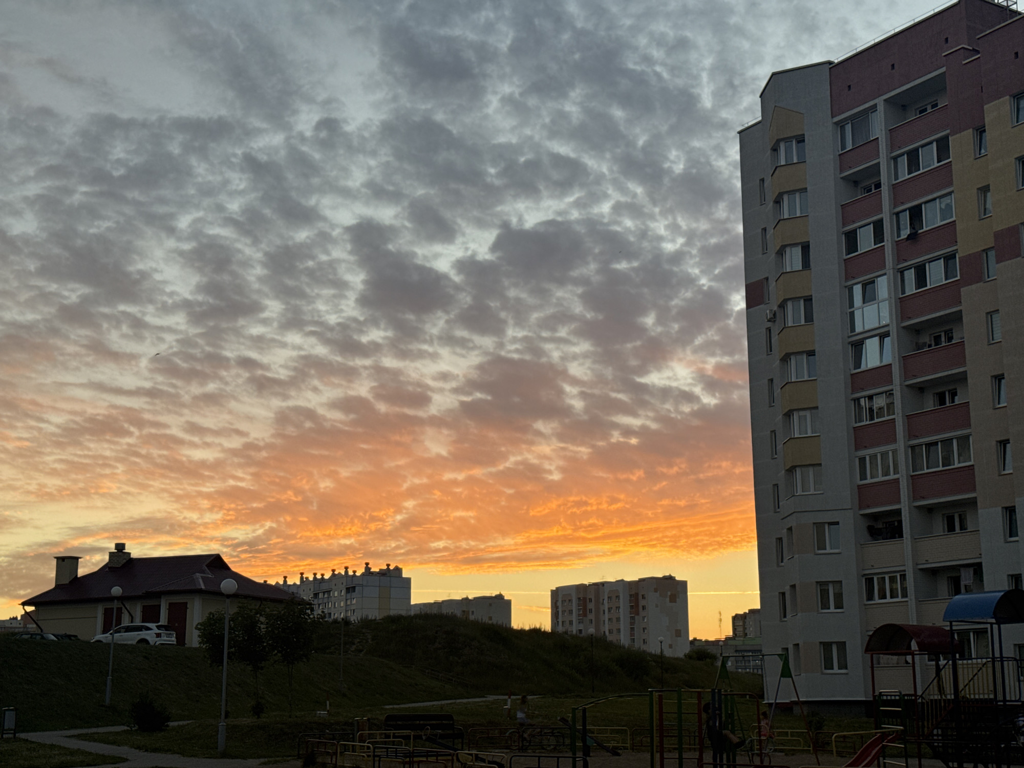 Sunset over Slonim's residential blocks, with a few car dashboard shots