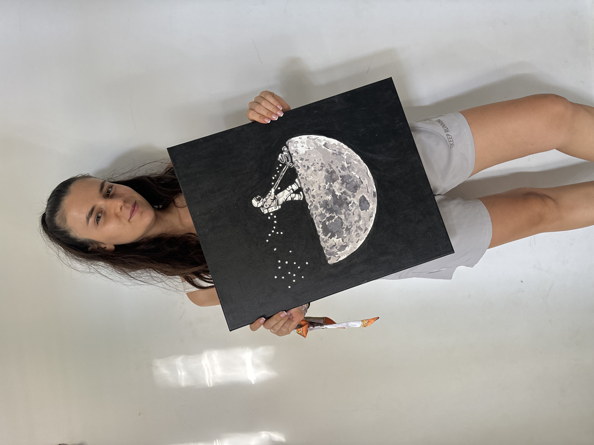 Woman displays moon mining artwork in Mũi Né Vietnam