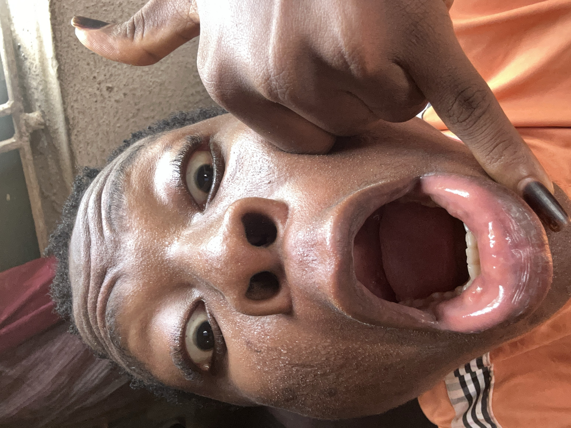 Young performer recorded singing with speaker, unusual camera angles