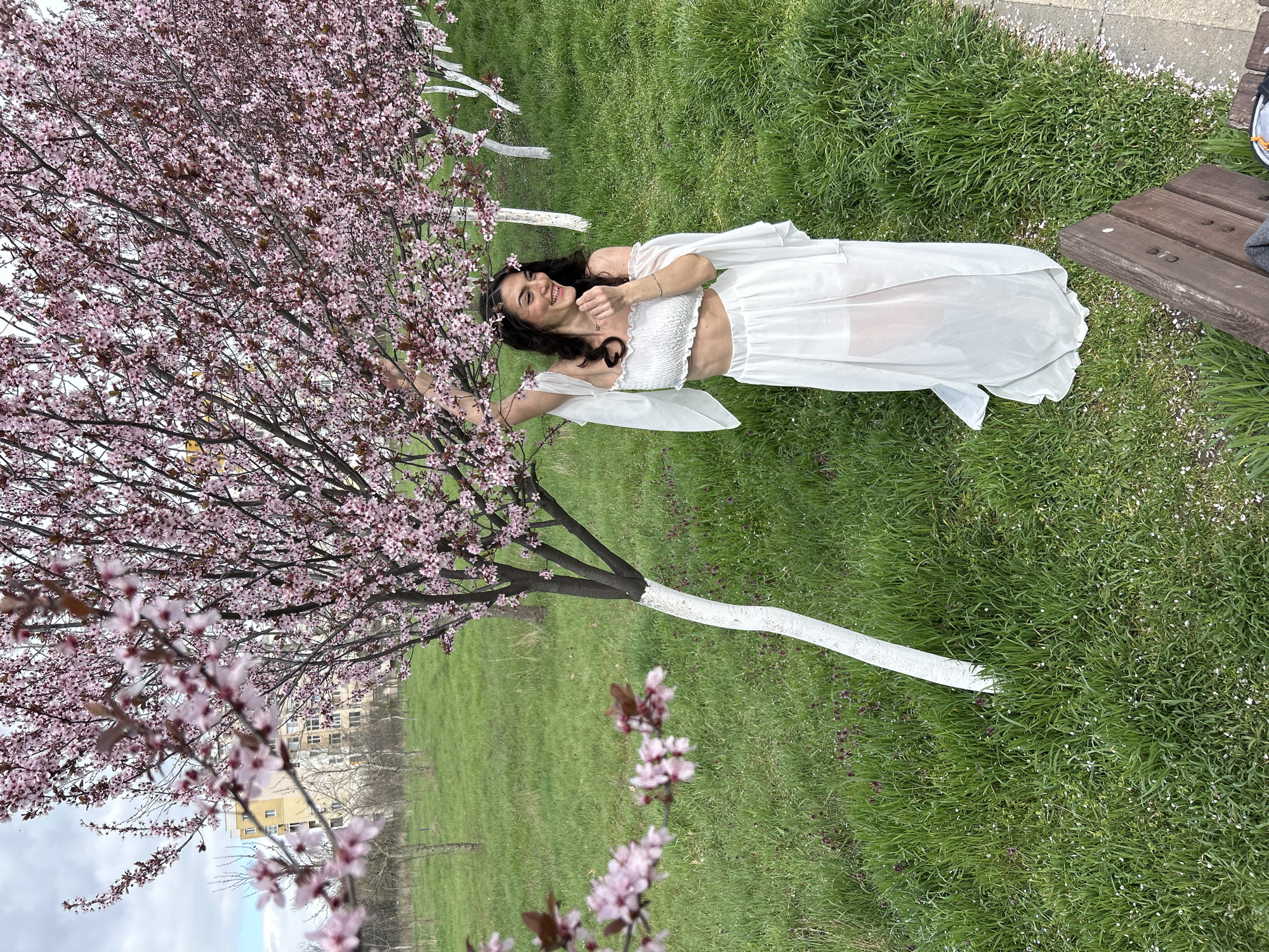 Woman rests near flowering tree in Plovdiv park