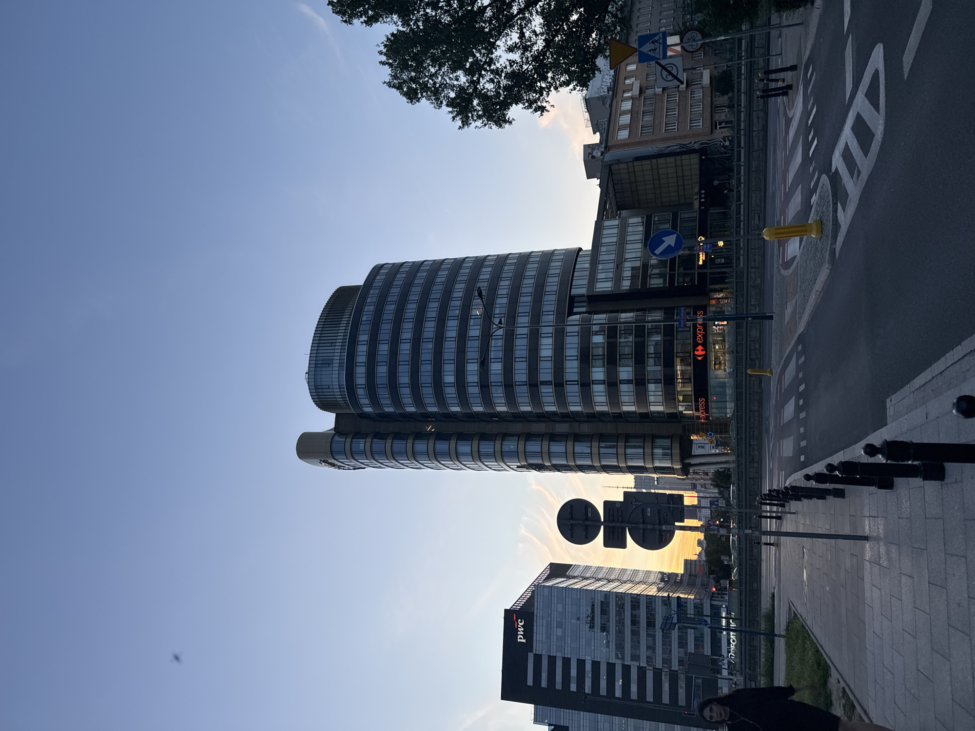 Evening street-level drift through a European urban neighborhood