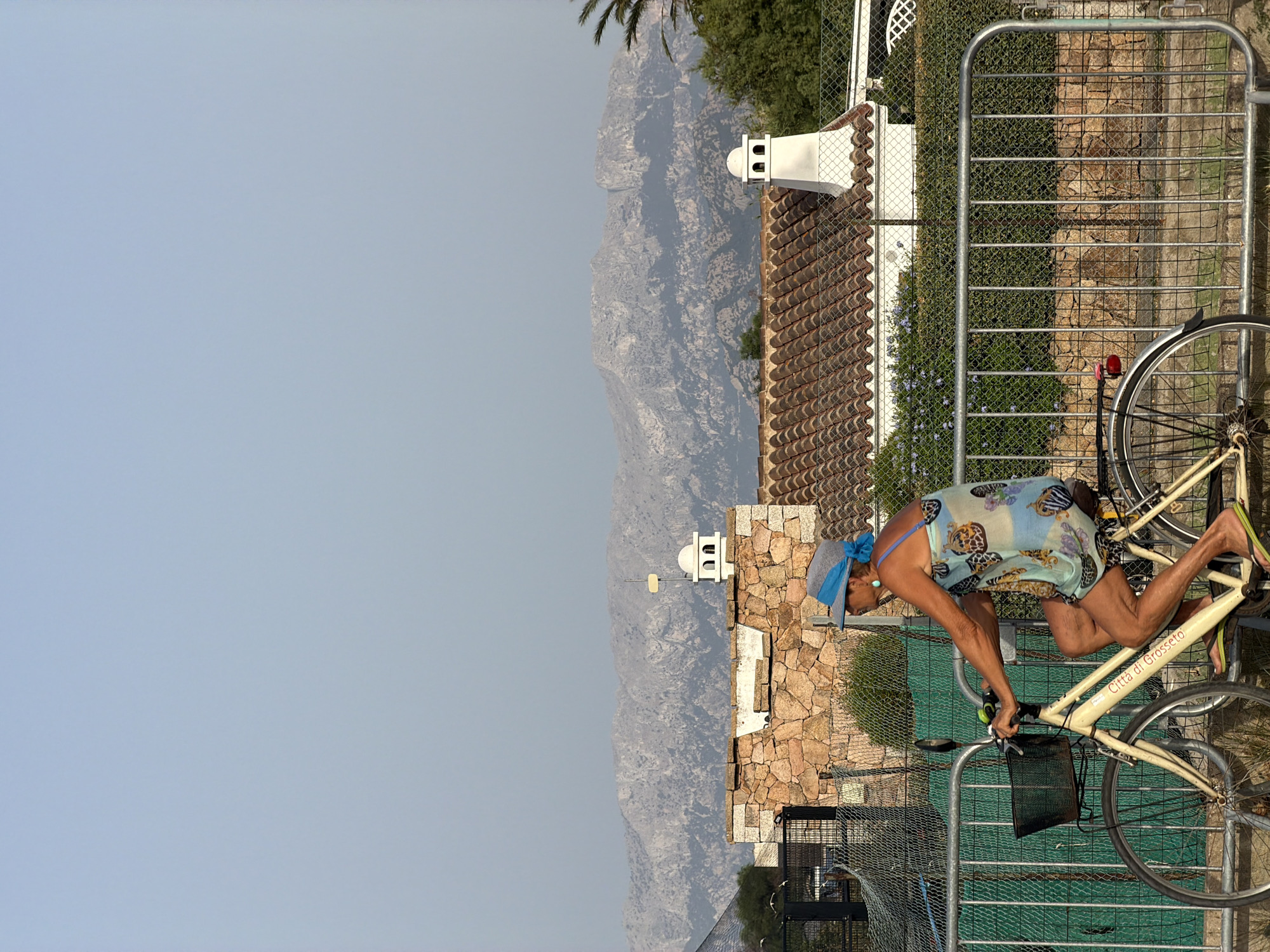 Summer afternoon in Olbia — streets, sea, and a drifting inflatable ring