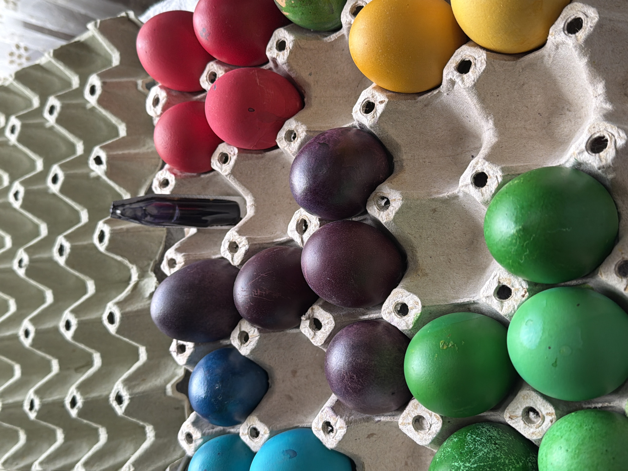 Rainbow-colored dyed eggs displayed in carton in Krushari, Bulgaria