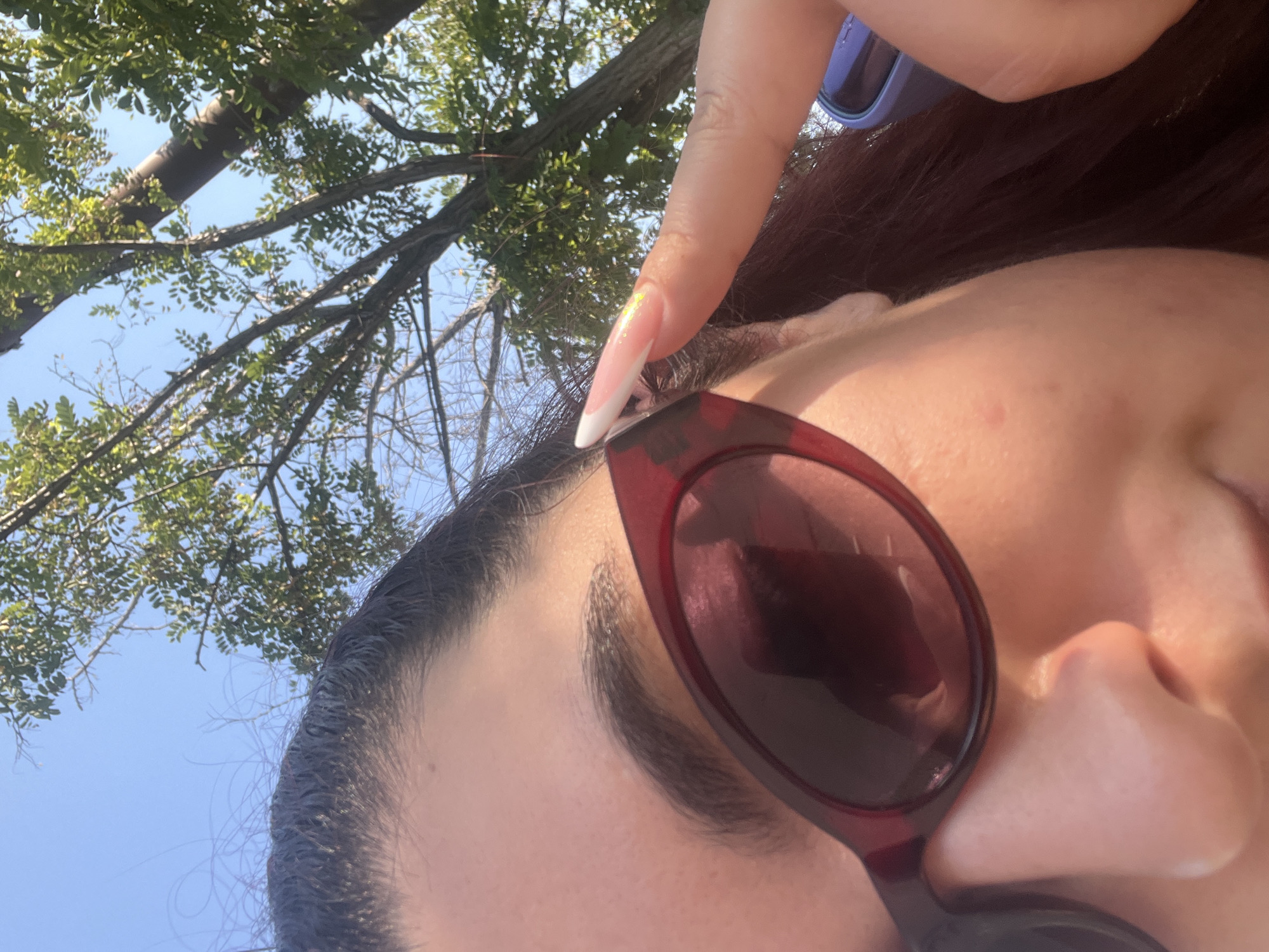 Close-up selfie detail: sunglasses and eye, Varna summer.