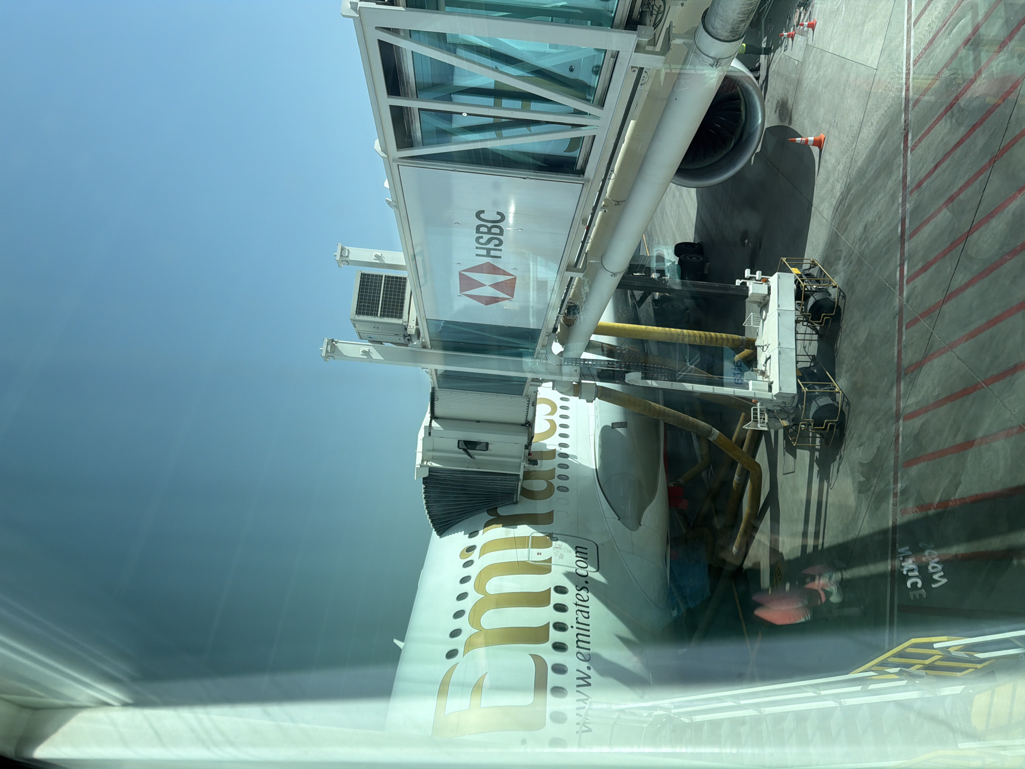 Emirates aircraft spotted at terminal gate with HSBC-branded jet bridge