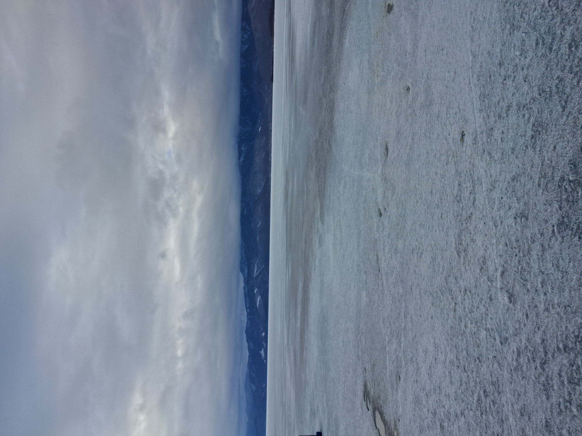 Cloudy skies observed over icy Kultuk landscape, Russia