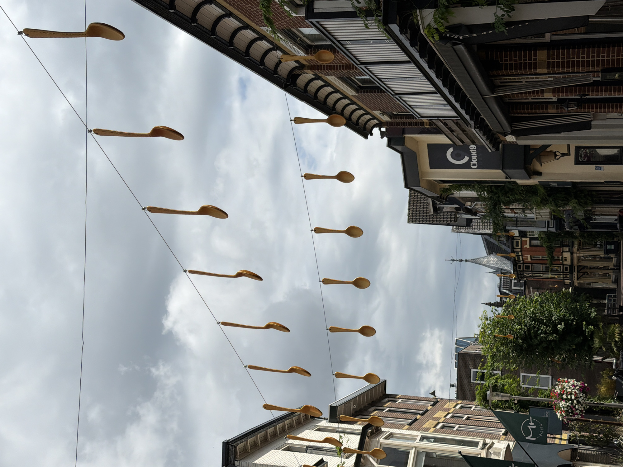 Giant wooden spoons hang over an Apeldoorn street in quirky installation