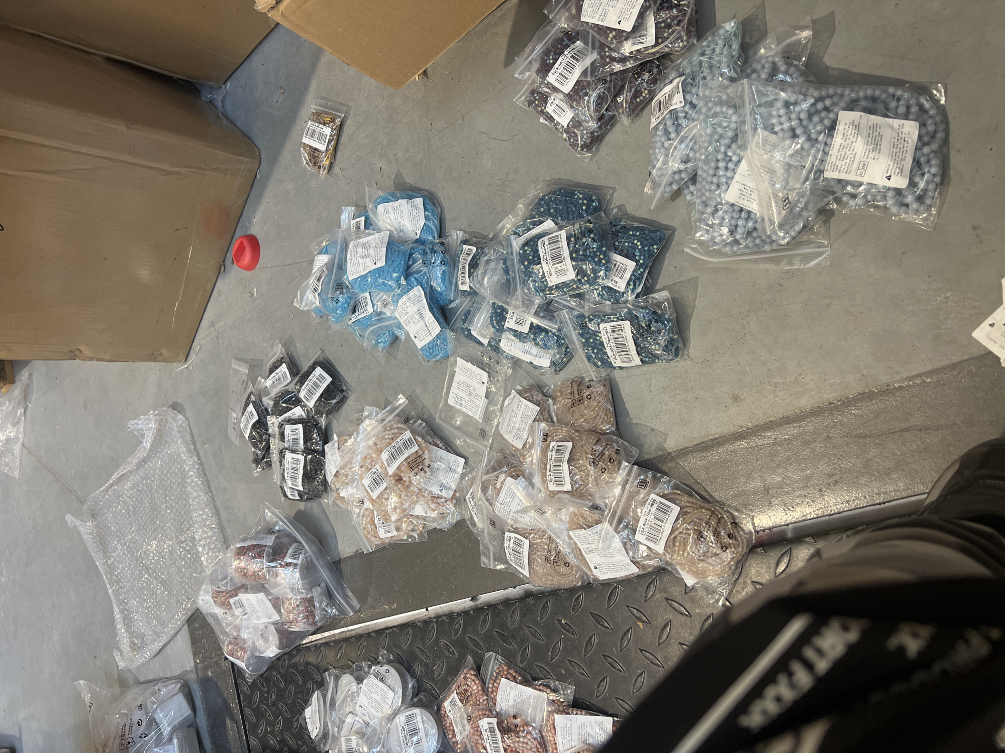 Packaged beads scattered with boxes in Burgas, Bulgaria