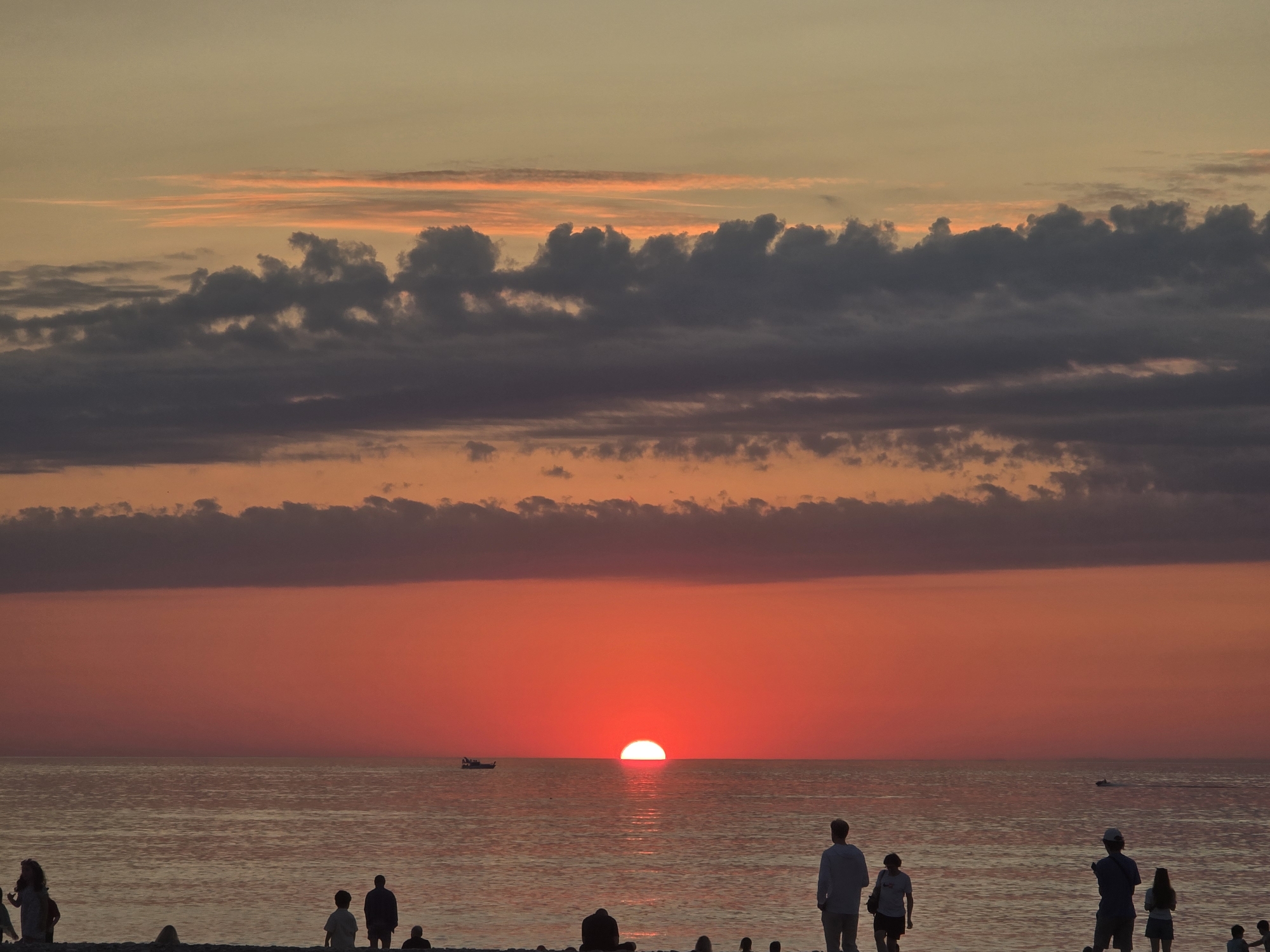 Sunset on a pebble beach near a Marriott resort