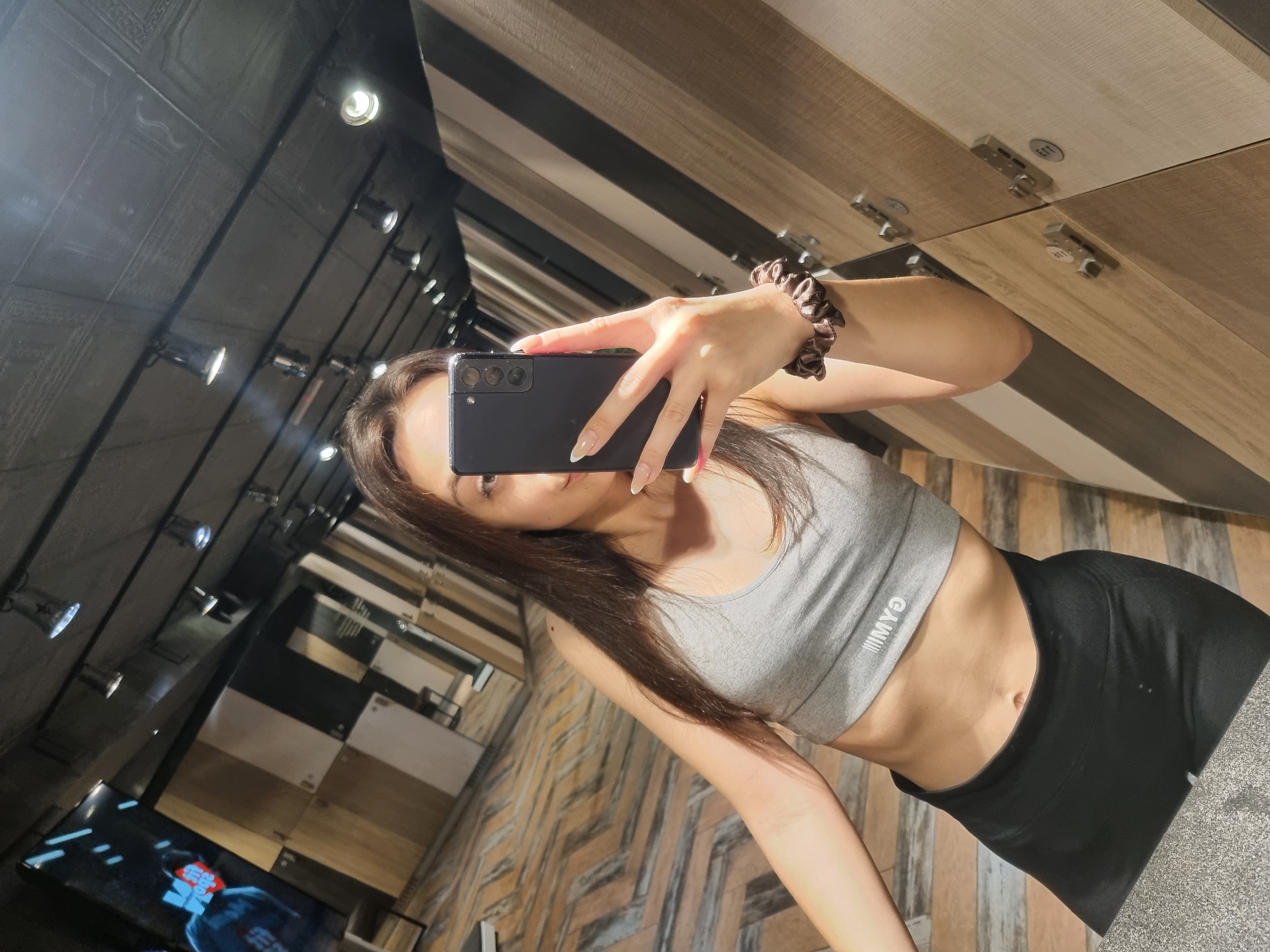 Woman takes gym selfies in Sofia fitness center