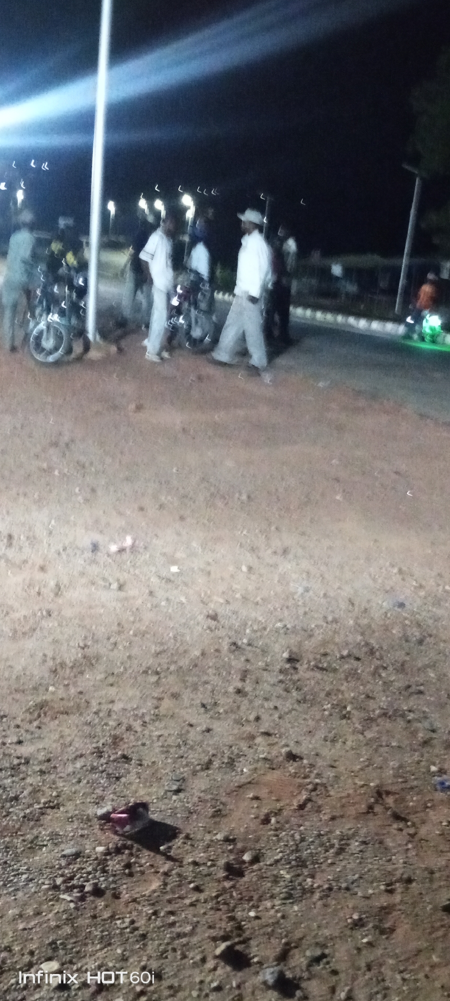 Nighttime motorcycle gathering in Adankolo, Nigeria draws small crowd