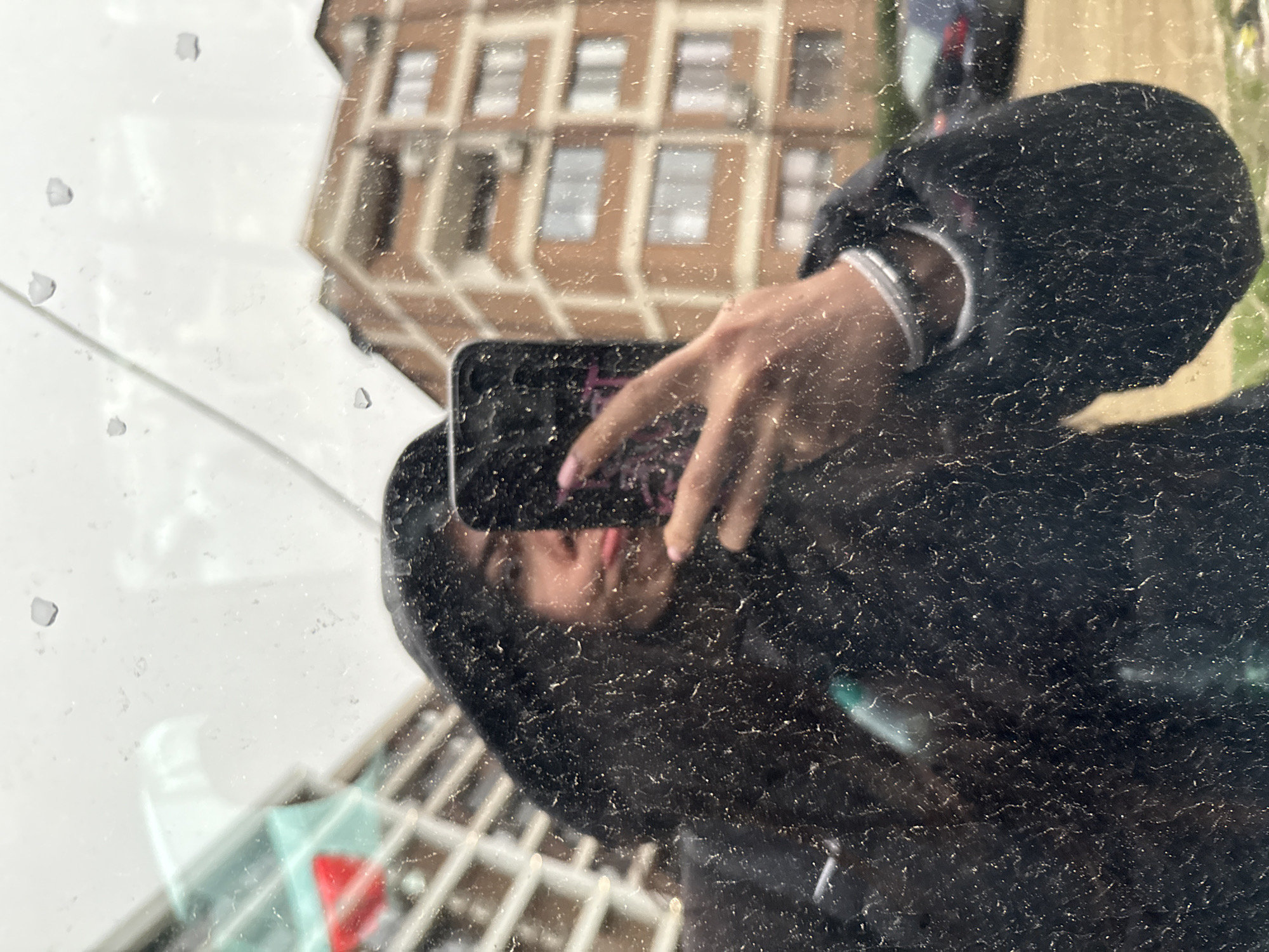 Early morning phone photography captured in Sofia window reflection