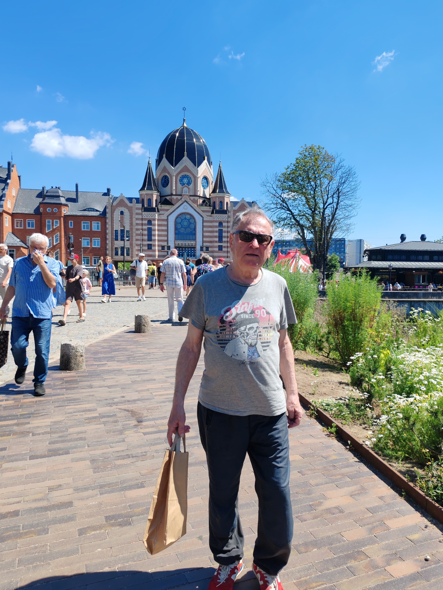 Summer morning along Kaliningrad's waterfront: pastries, promenades, and street life