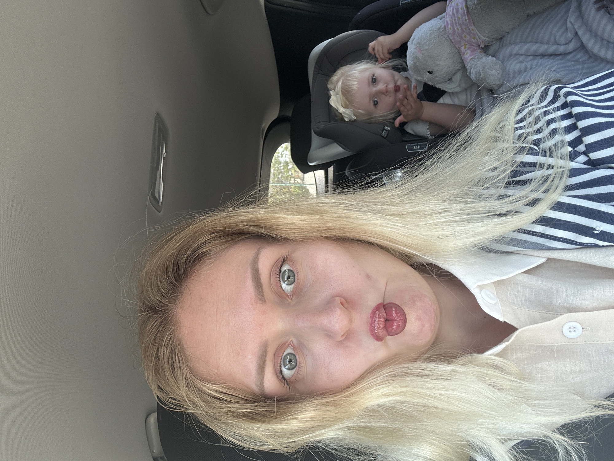 Woman takes selfies in car with child, Petah Tikva