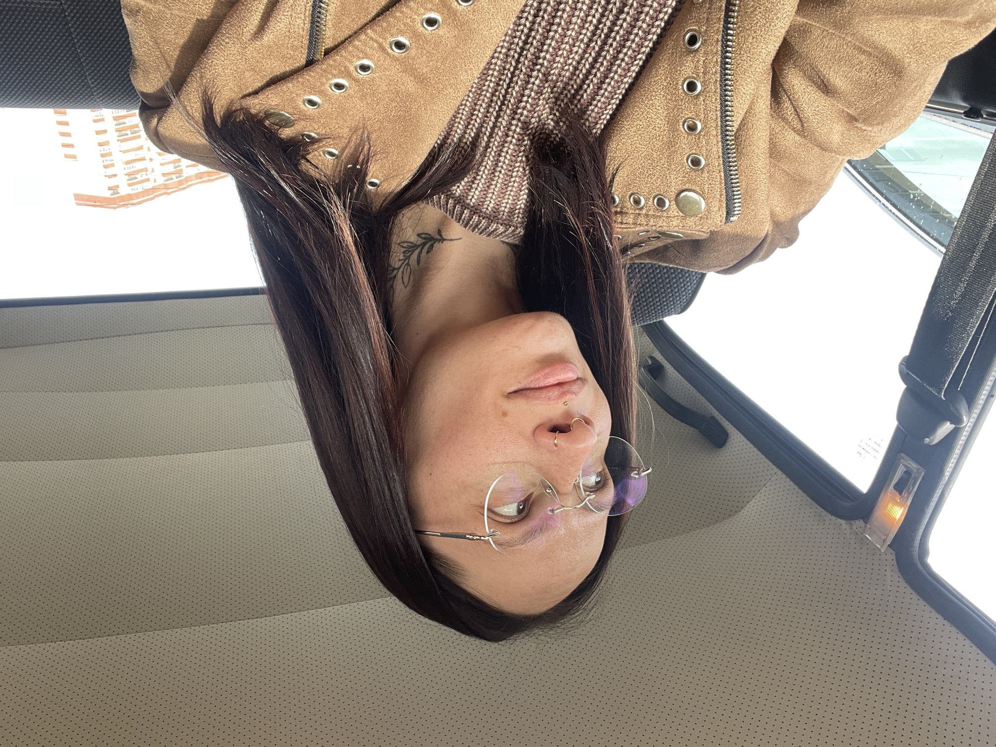 Woman with piercings photographed in car in Izhevsk