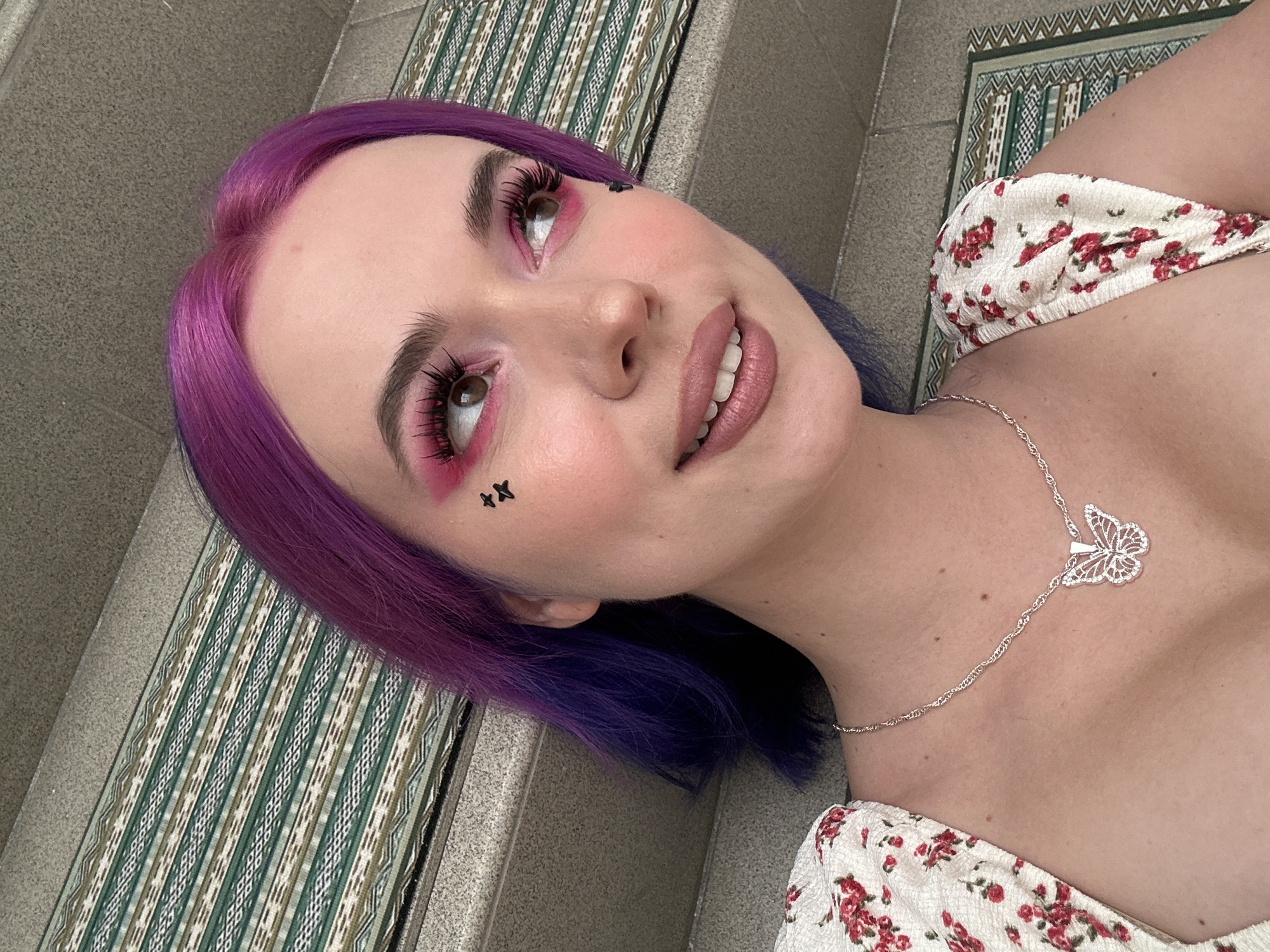 Purple-haired woman photographed in multiple poses in Ljubljana