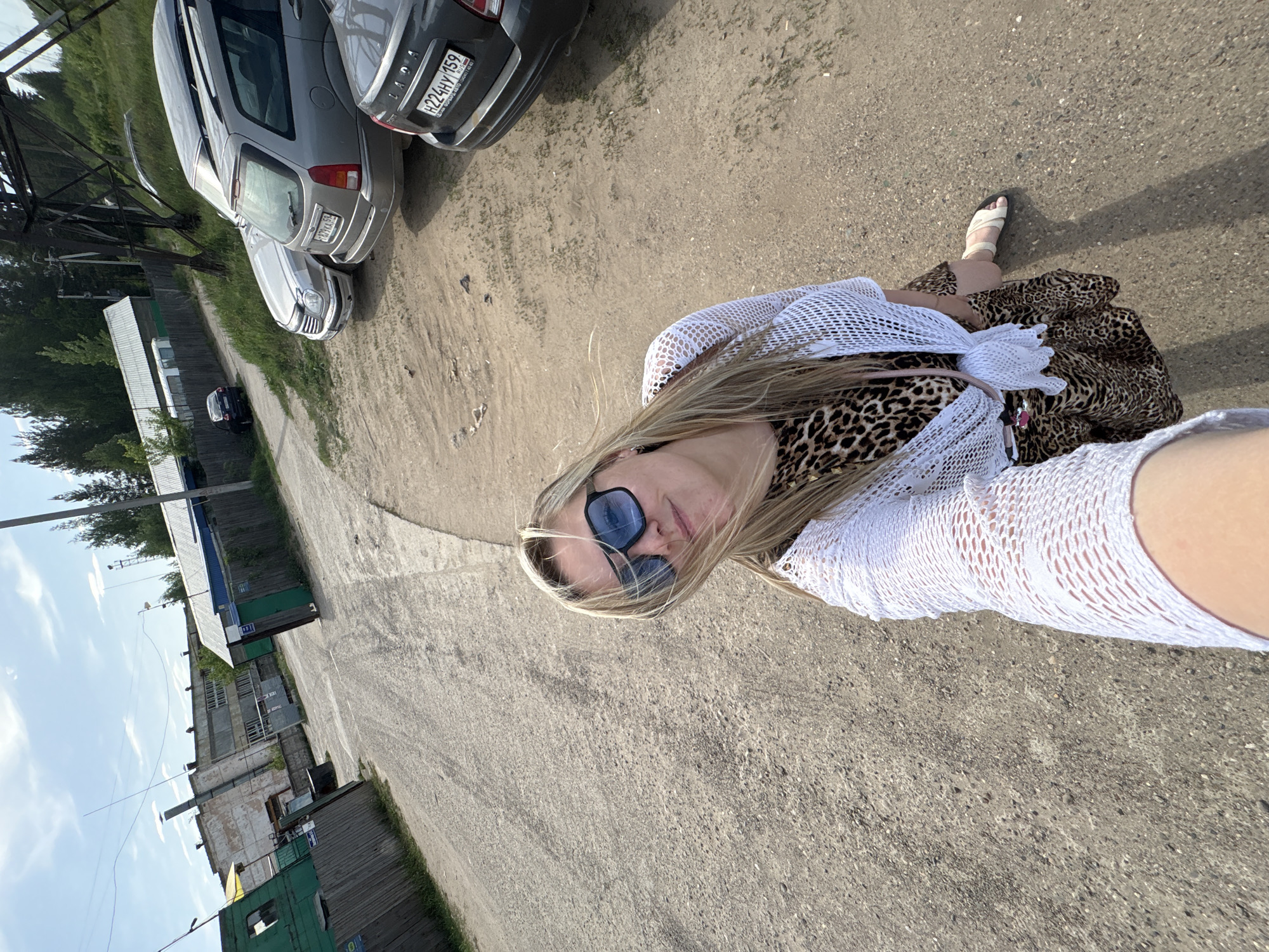 Woman takes selfies near power lines in Noviy, Russia