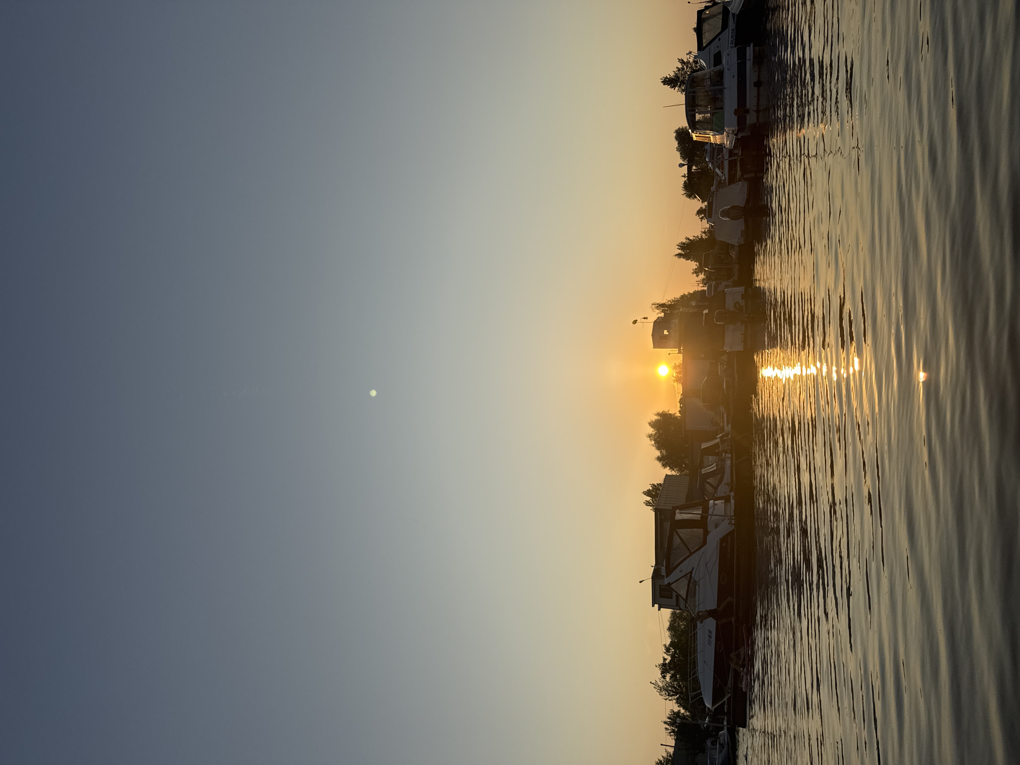 Summer evening on the Kama River: swimming, paddleboarding, and sunset