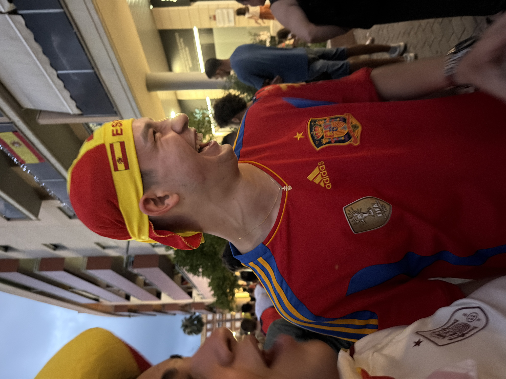 Spanish football fan in full kit, laughing in Dénia