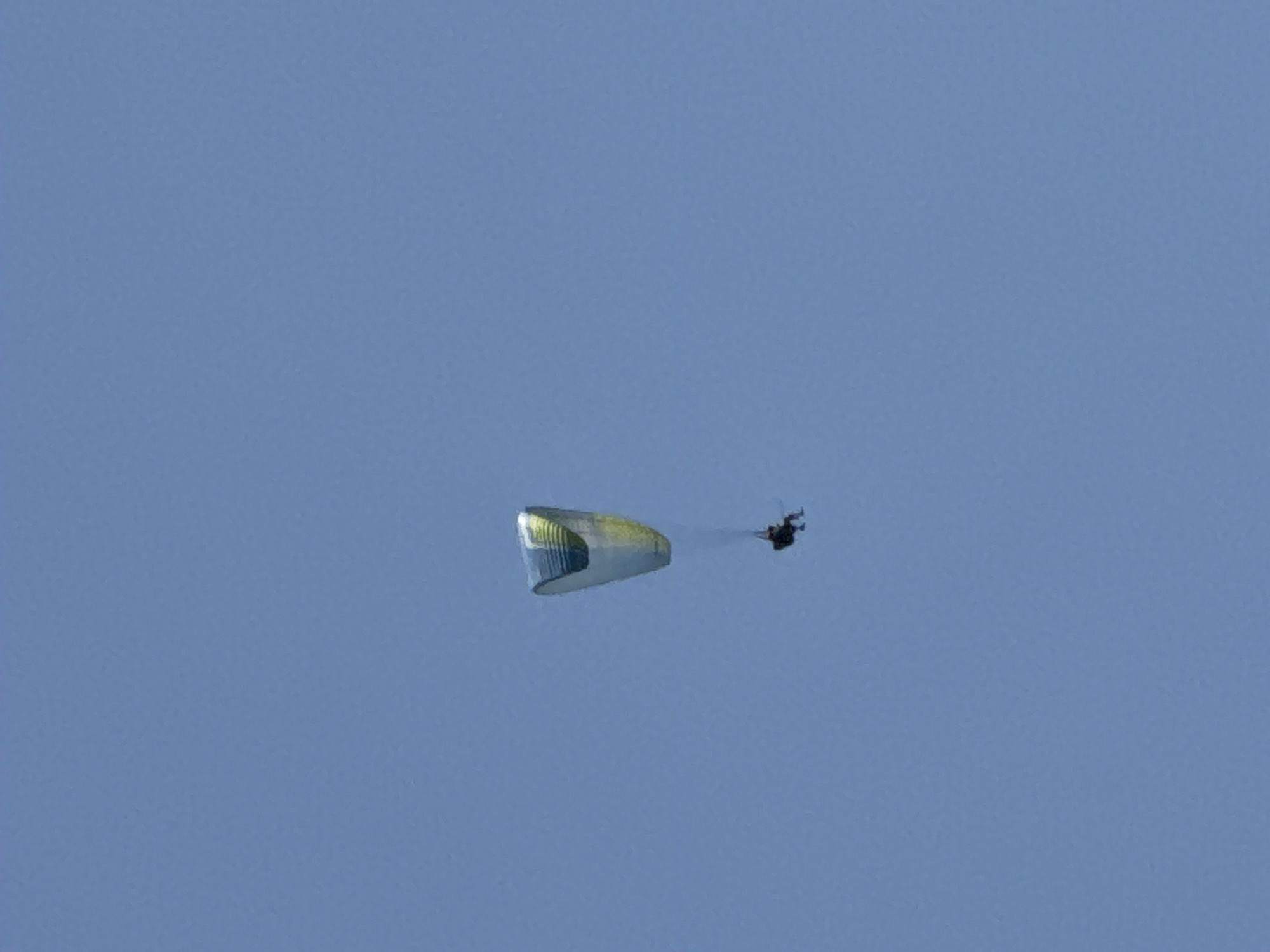 Paragliding and coastal life in Boreti on a clear morning