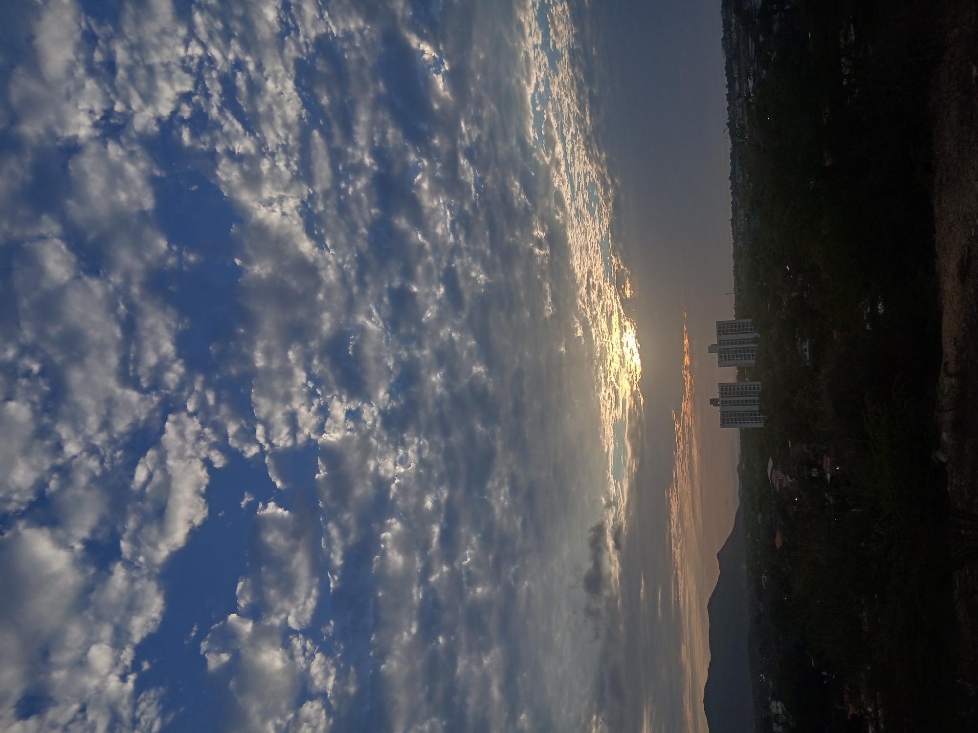 Sunset documented across Juan Griego cityscape, Venezuela