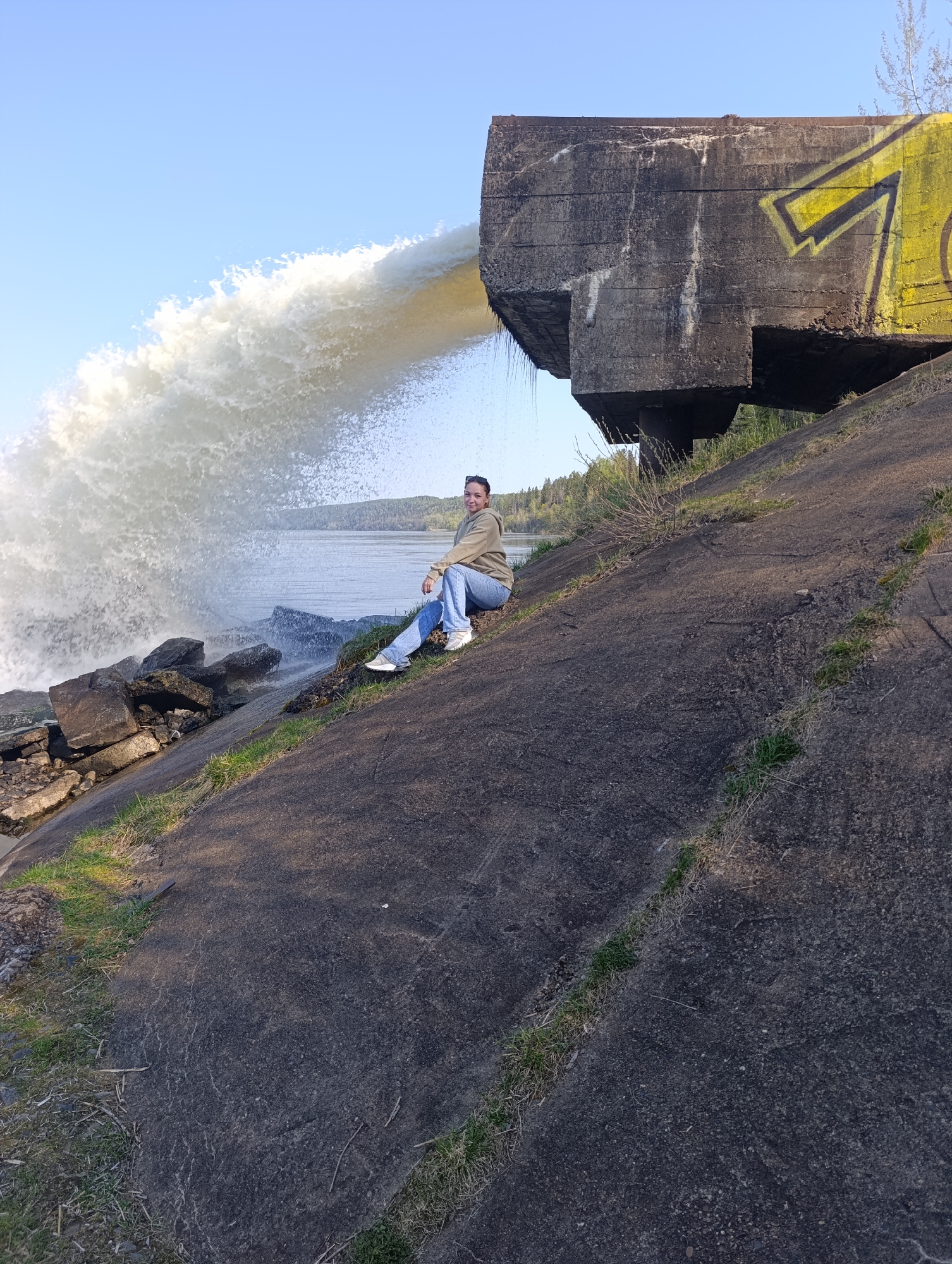Couple photographs at waterfront infrastructure site in Chernushka