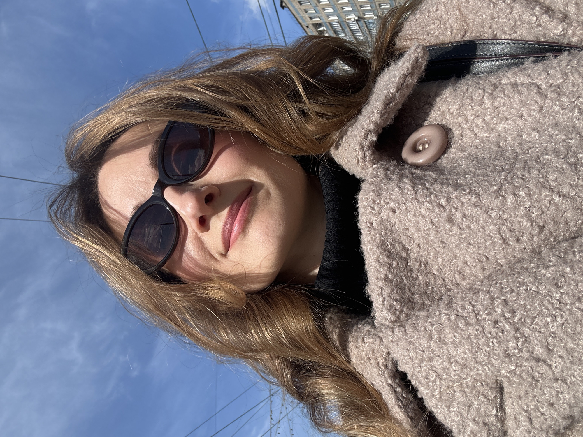 Woman takes selfie on sunny morning in Kryvyi Rih
