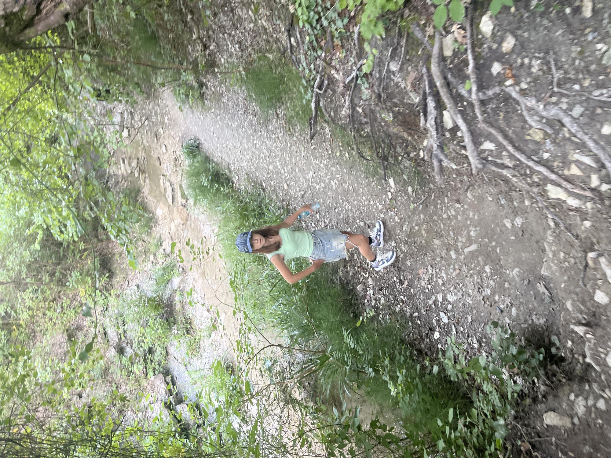 Hiking through a rocky gorge with waterfalls and forest trails