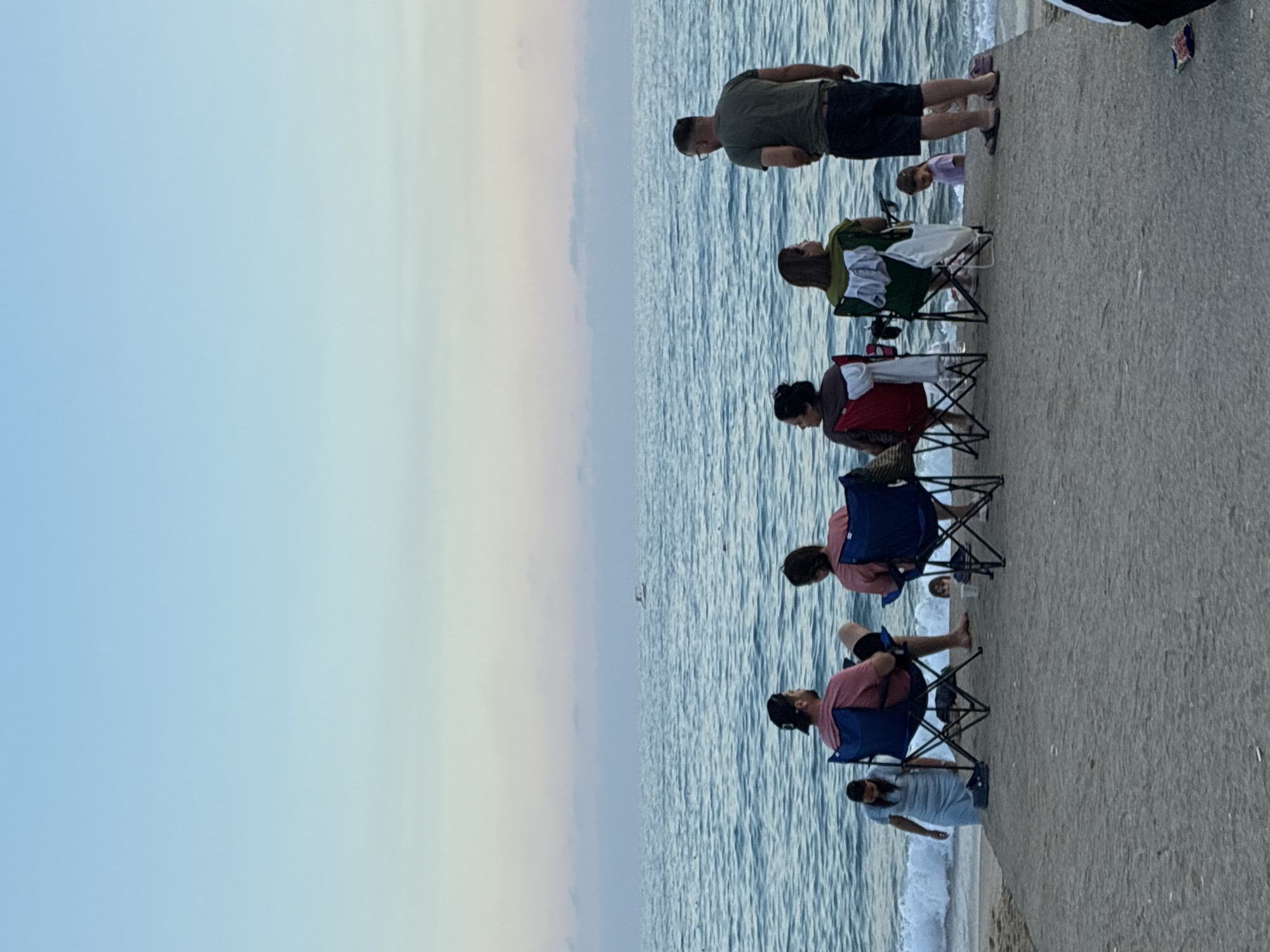 Sunset at Cleopatra Beach, Alanya — people, ships, and a sleeping cat