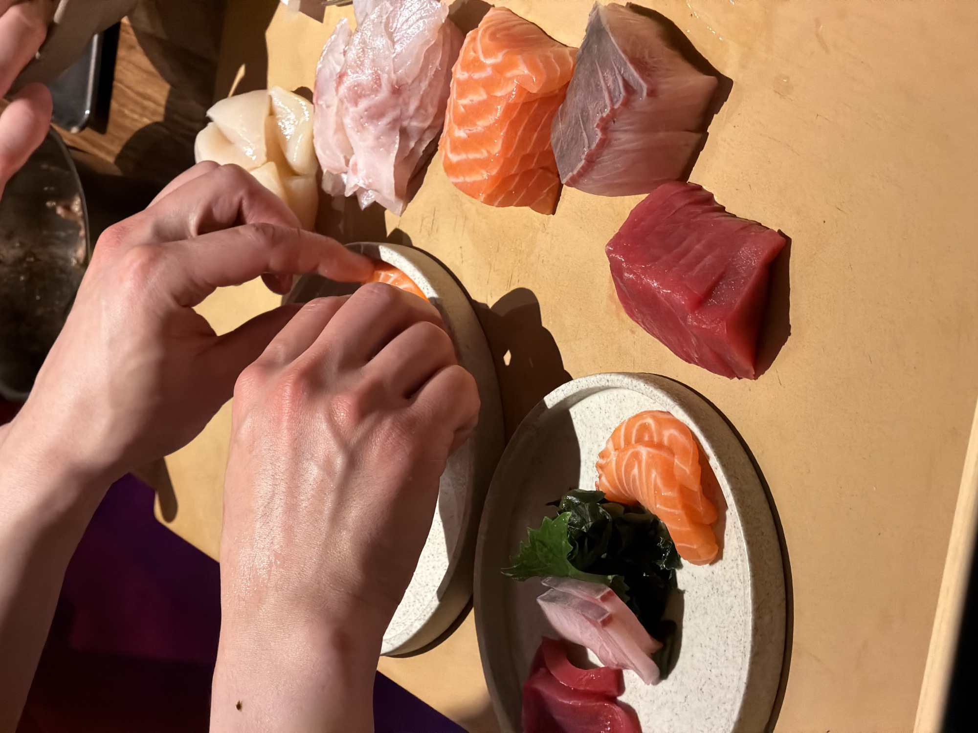 Moscow sushi chefs prepare fresh sashimi during afternoon service