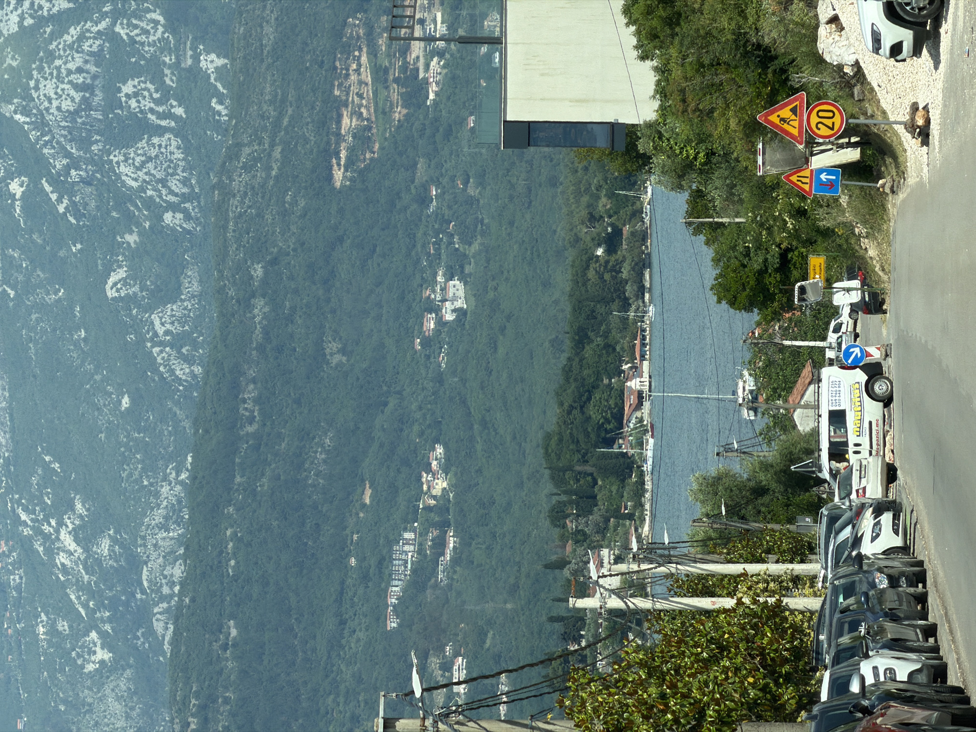 Elevated view captures road scene in Milovići, Montenegro