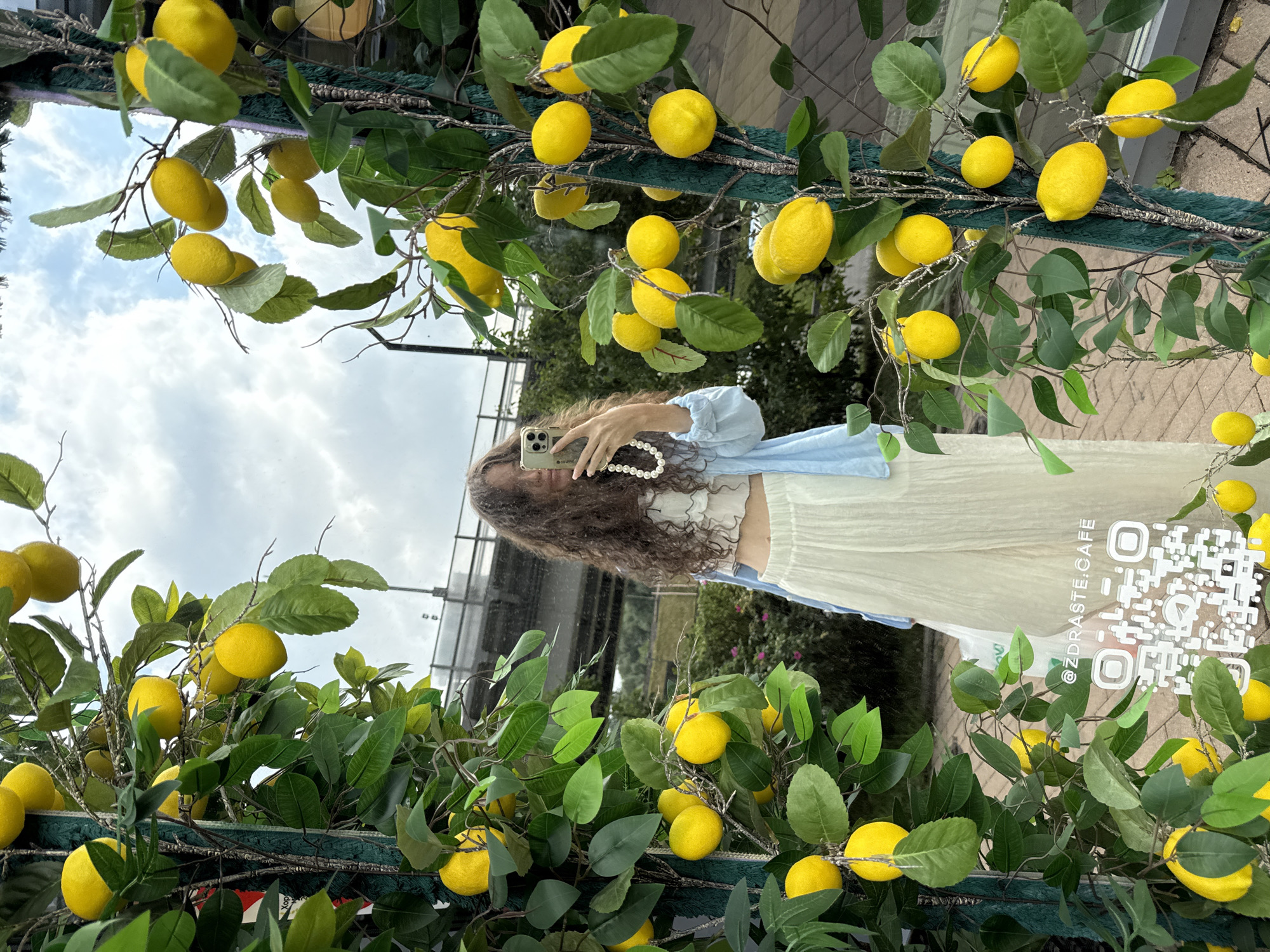 Selfie moment at a decorative lemon tree archway in Khimki