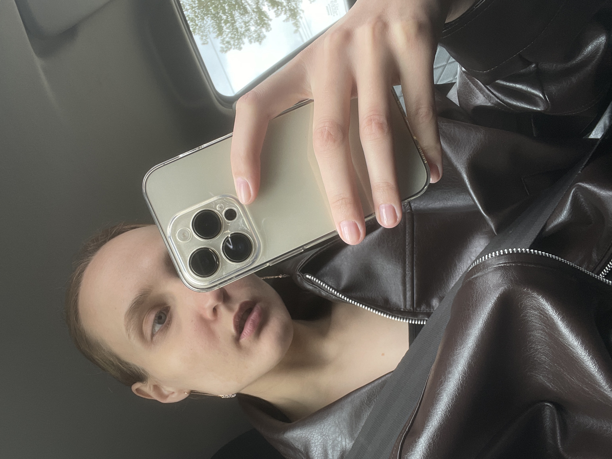 Person takes selfie, holds sunflower seeds in Sharkan vehicle