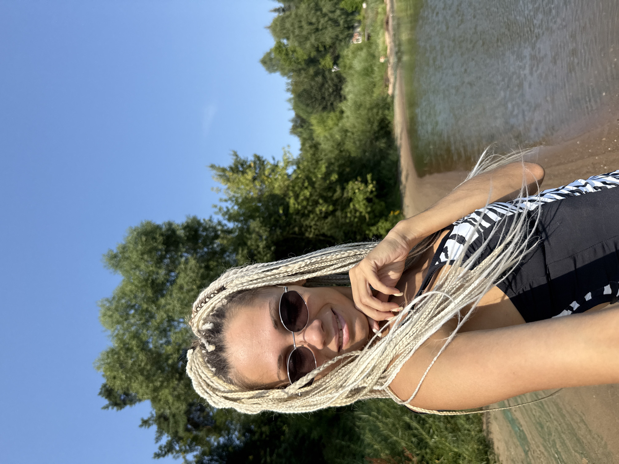 Beach selfies at a sunny Russian waterfront on a summer morning