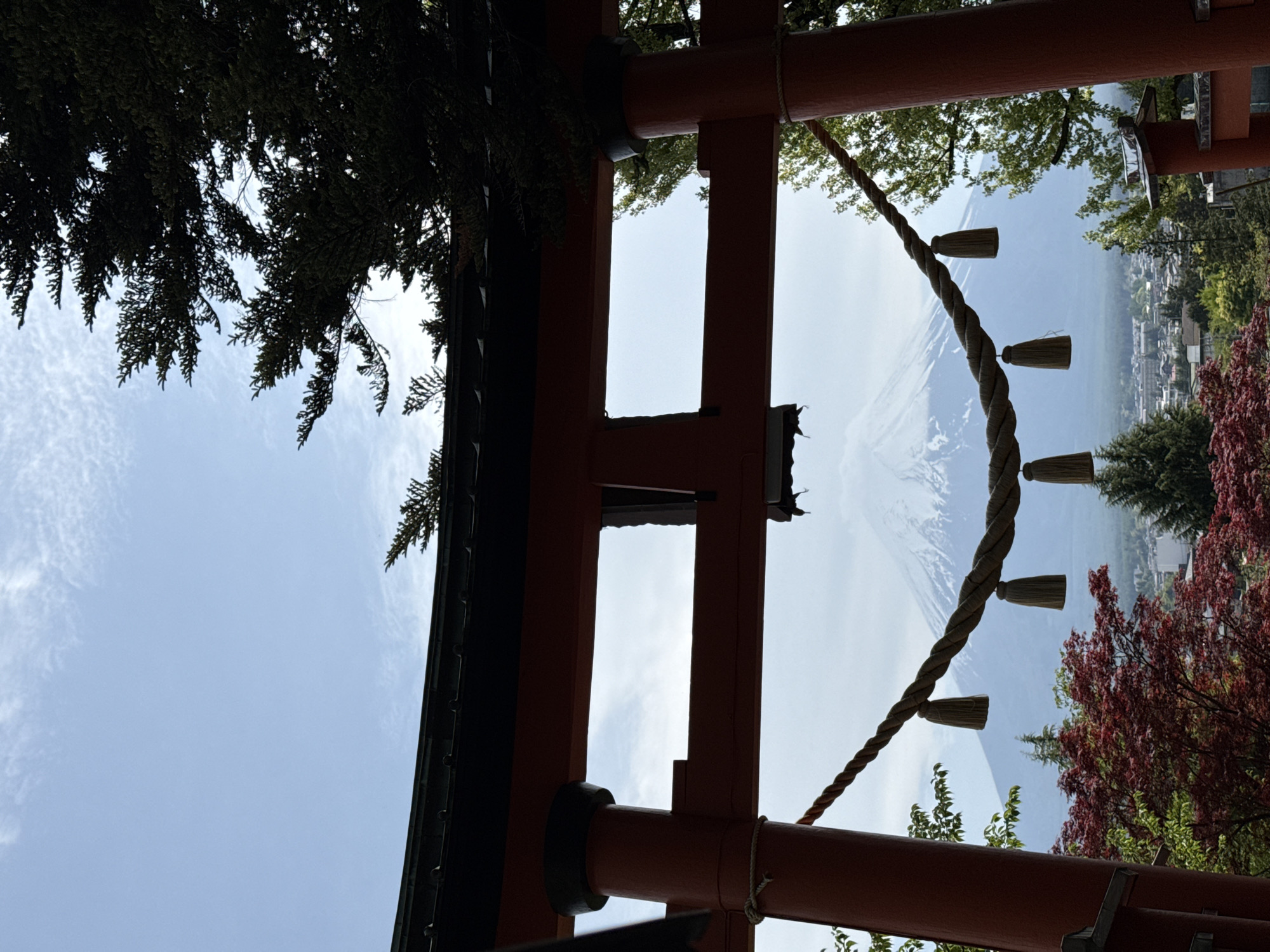 Mount Fuji photographed through torii gate in Fujiyoshida