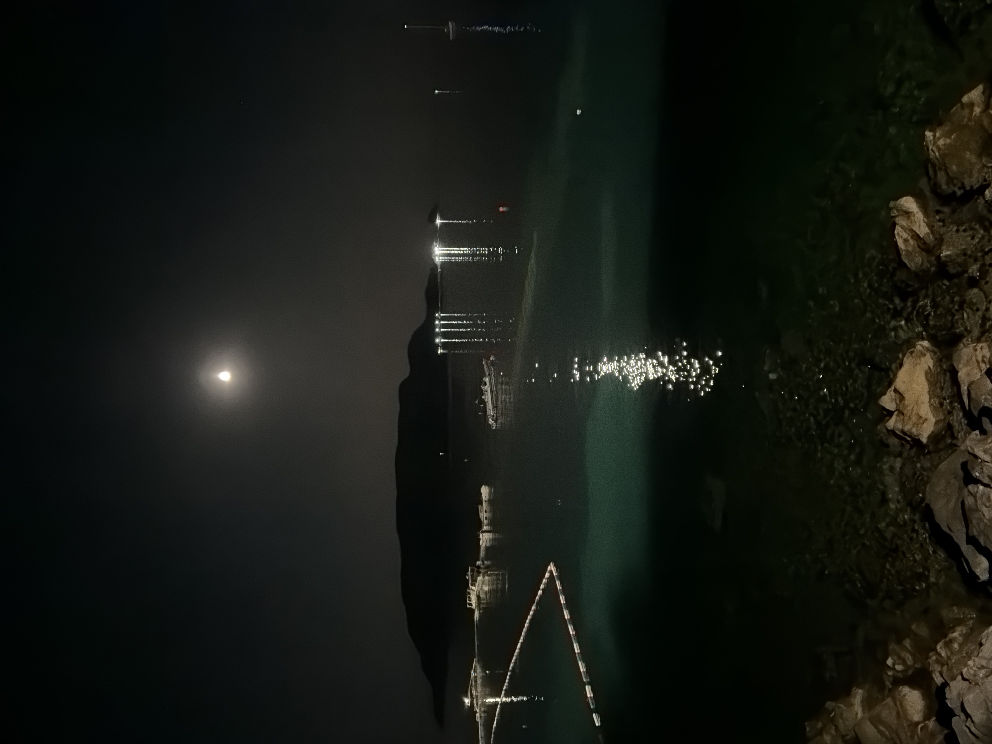 Budva's coastline at night, bay reflections and clifftop bars