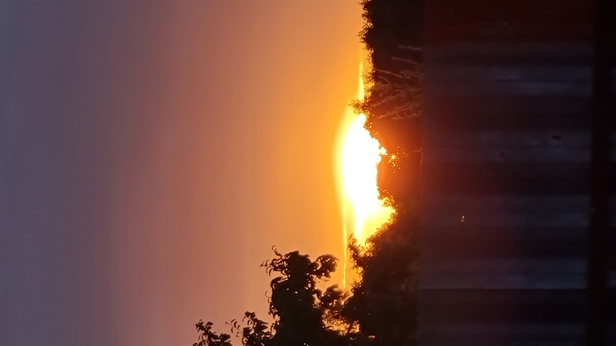 Sunset over Vysokoe's residential outskirts, July 2026
