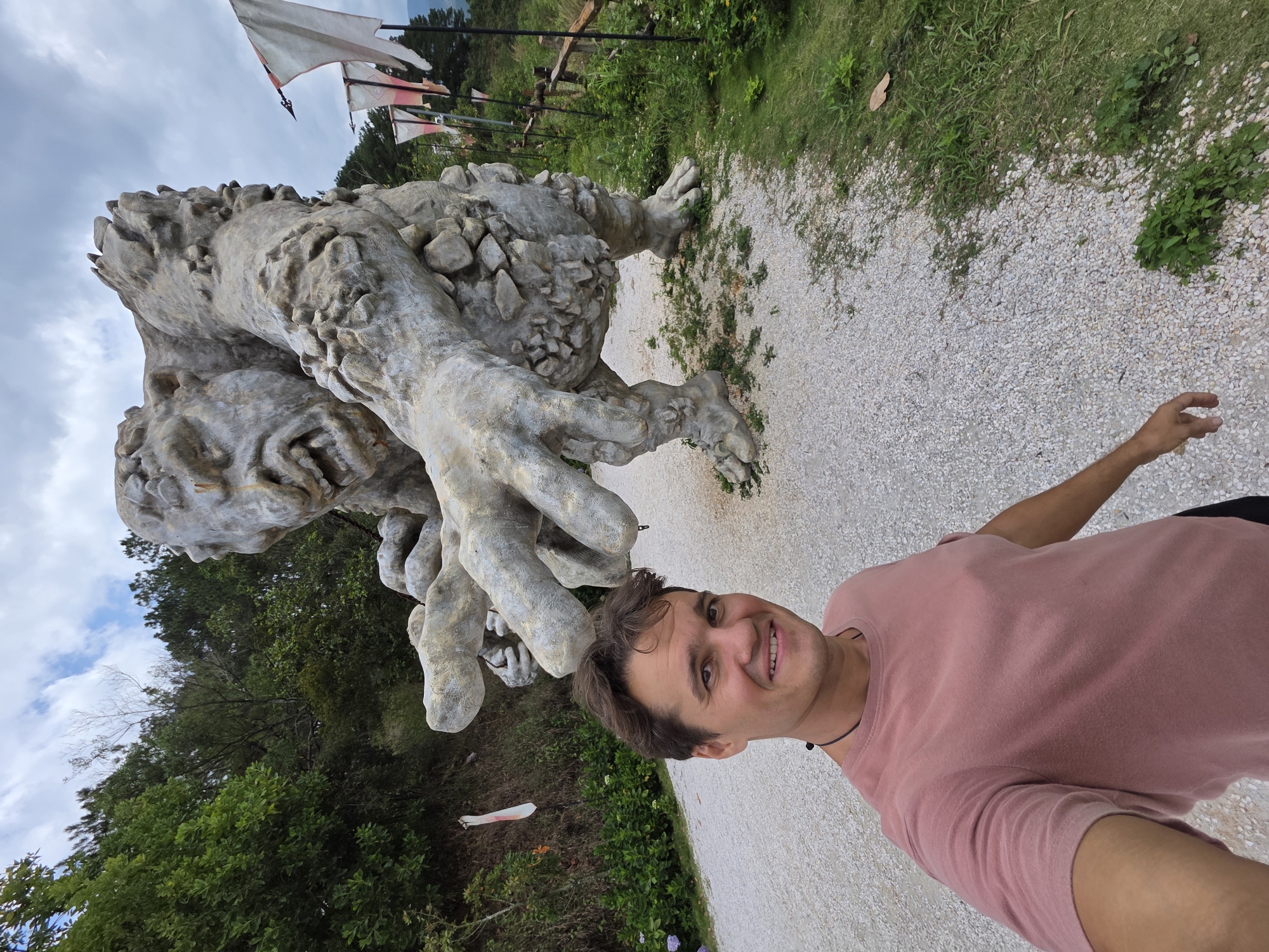 Tourists pose with stone sculptures at Vietnamese attraction site