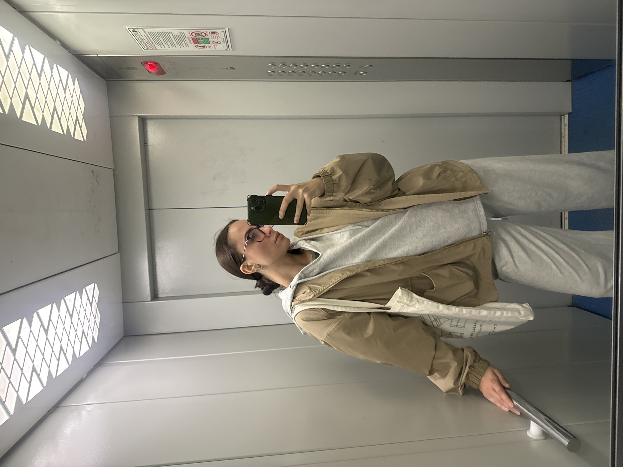 Woman takes elevator selfie in Krasnoyarsk mirror
