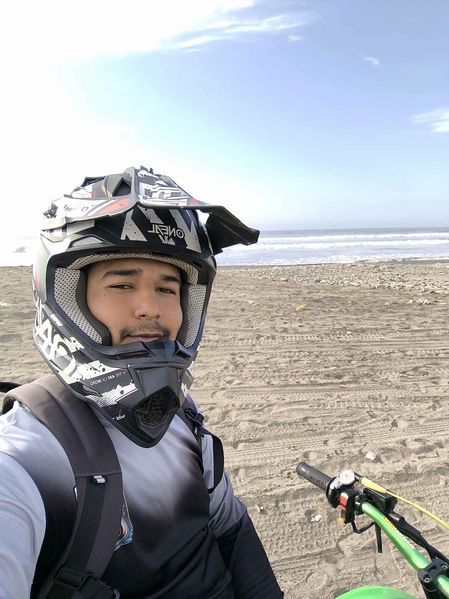 Motorcyclist photographed riding dirt bike on Huanchaco beach