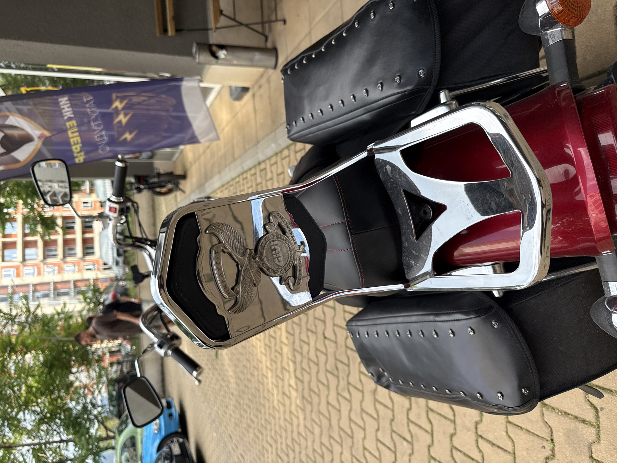 Red motorcycle and garden flowers documented in Sofia