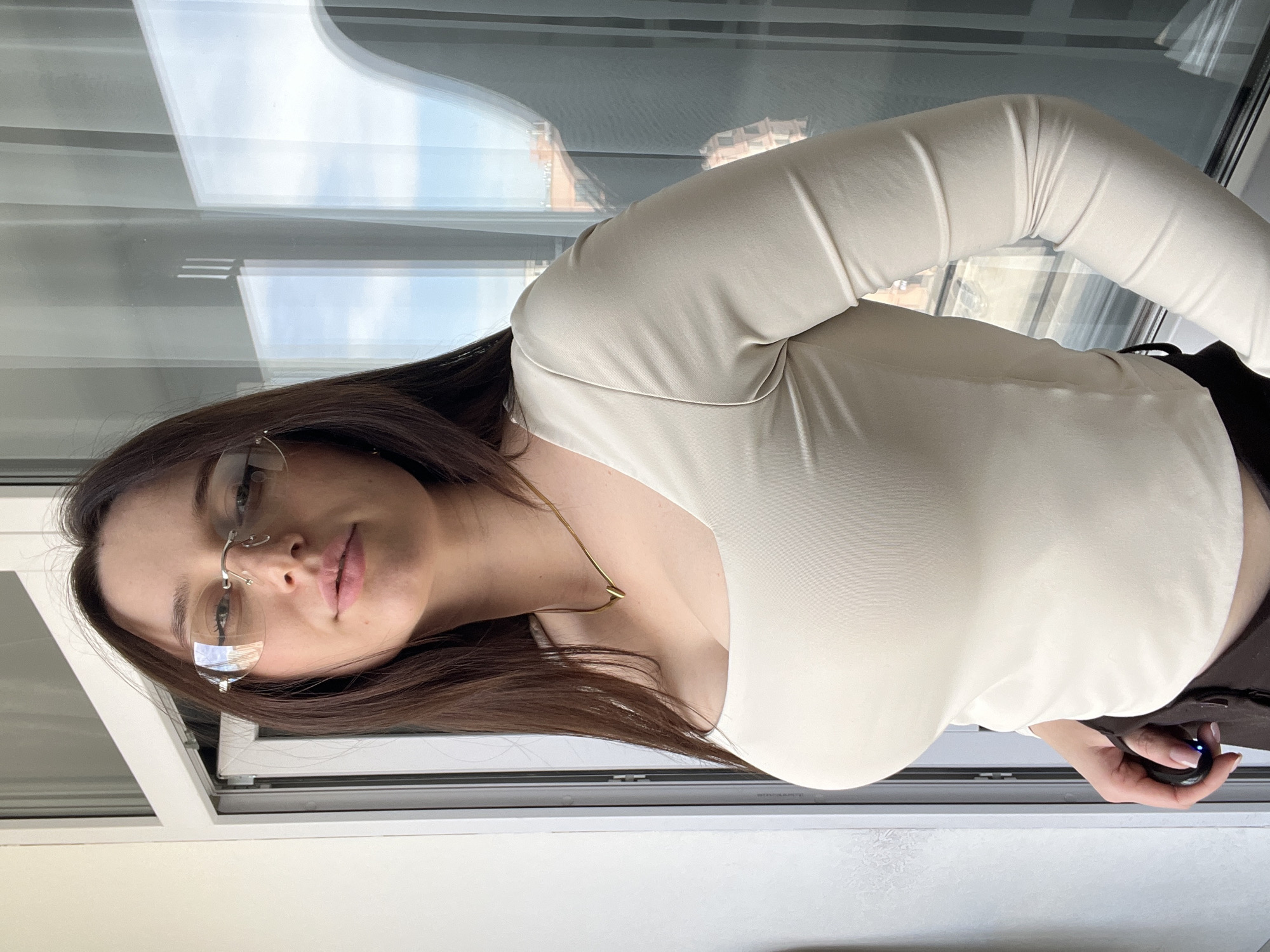 Woman photographed in multiple poses inside Tyumen apartment
