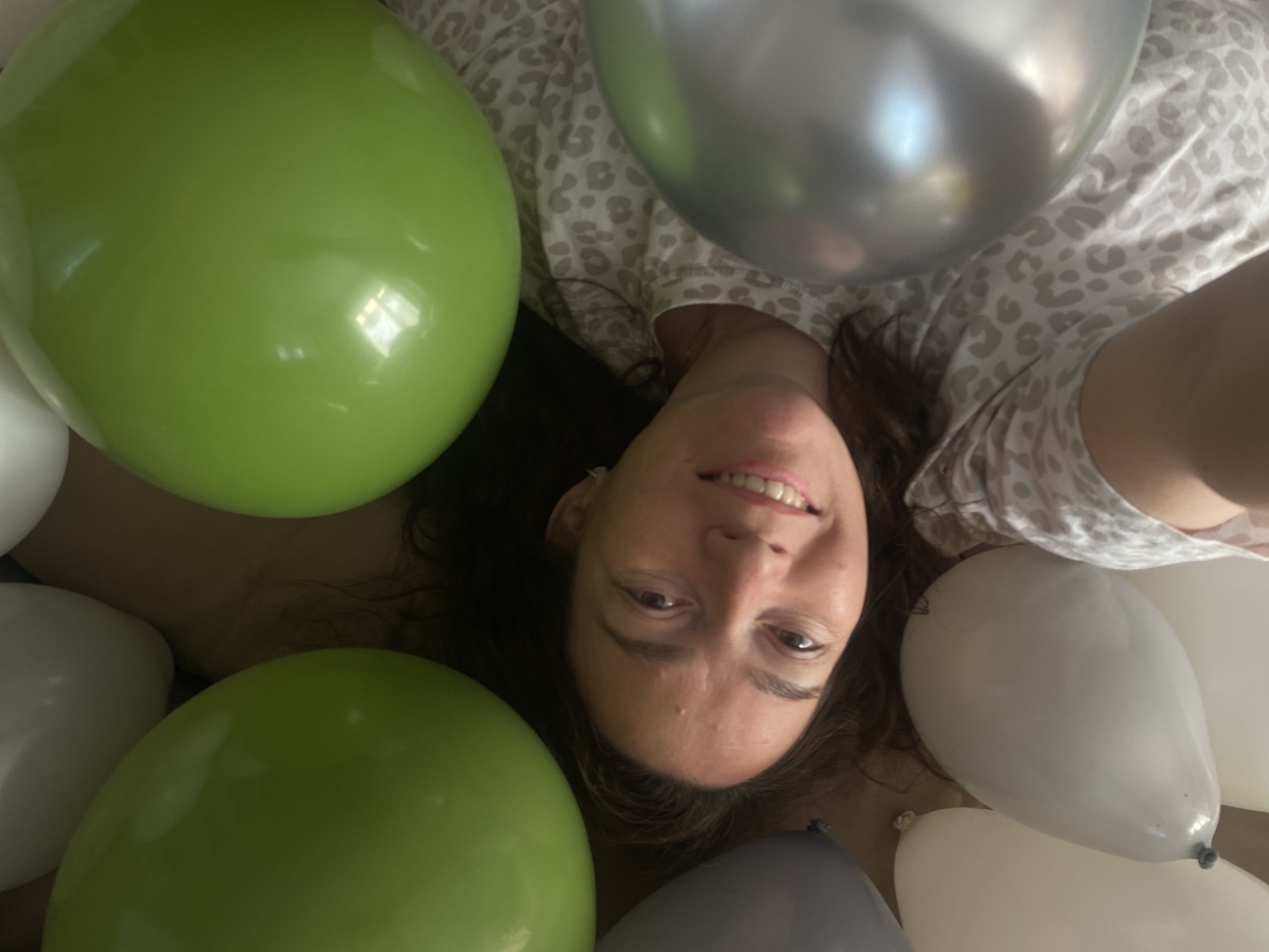 Woman surrounded by balloons in Russian town