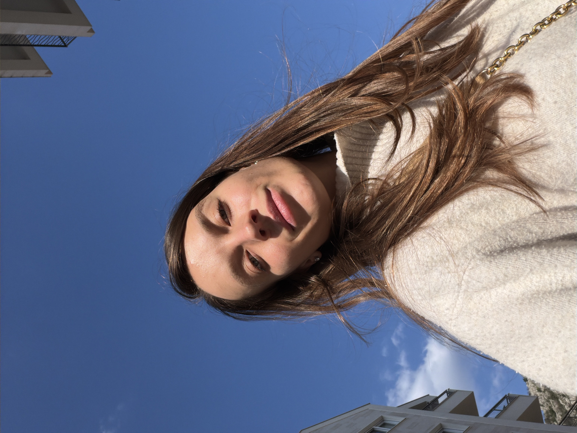 Woman in white hoodie photographed in Budva, Montenegro