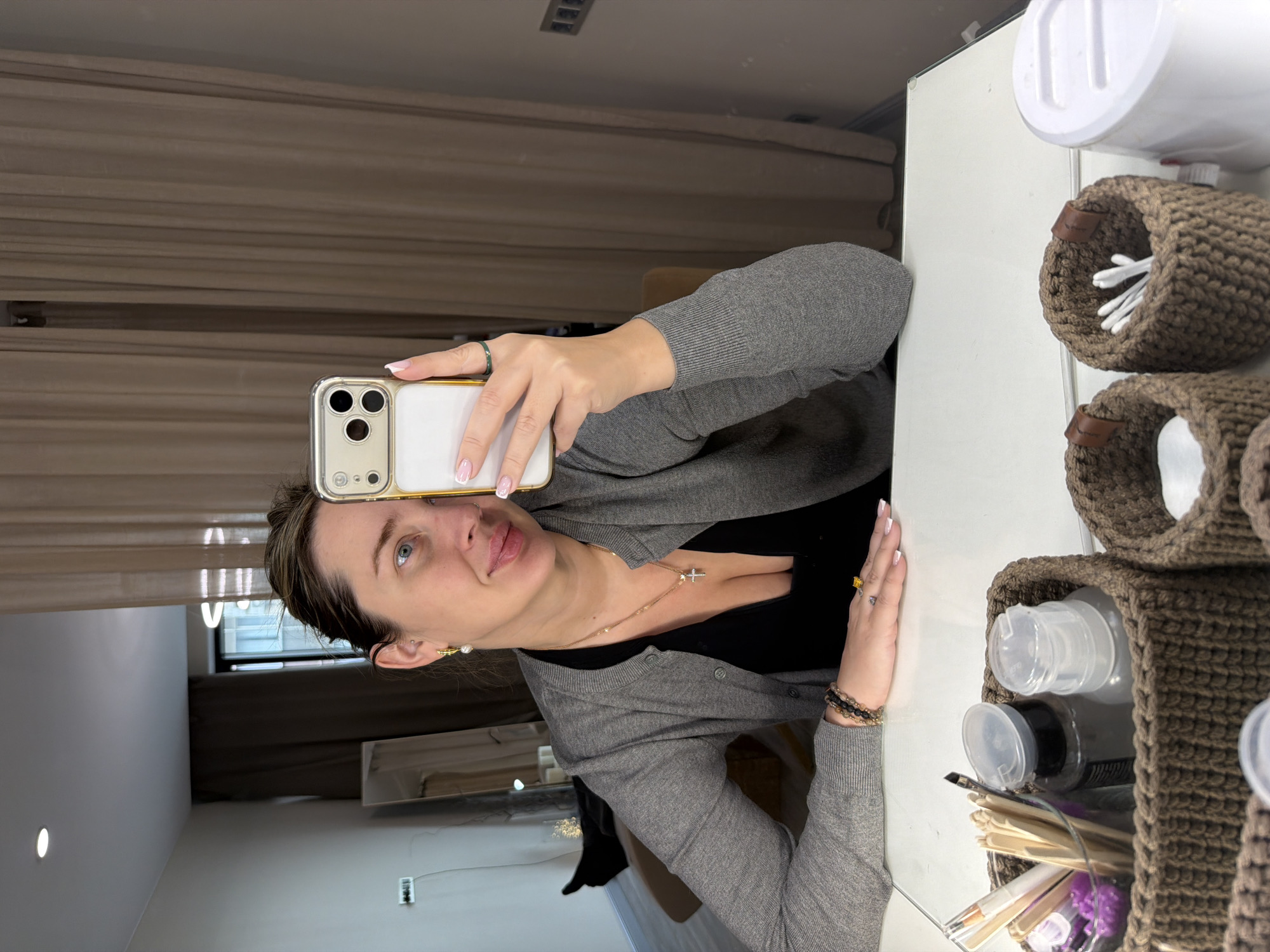 Woman takes mirror selfie with iPhone in Khimki